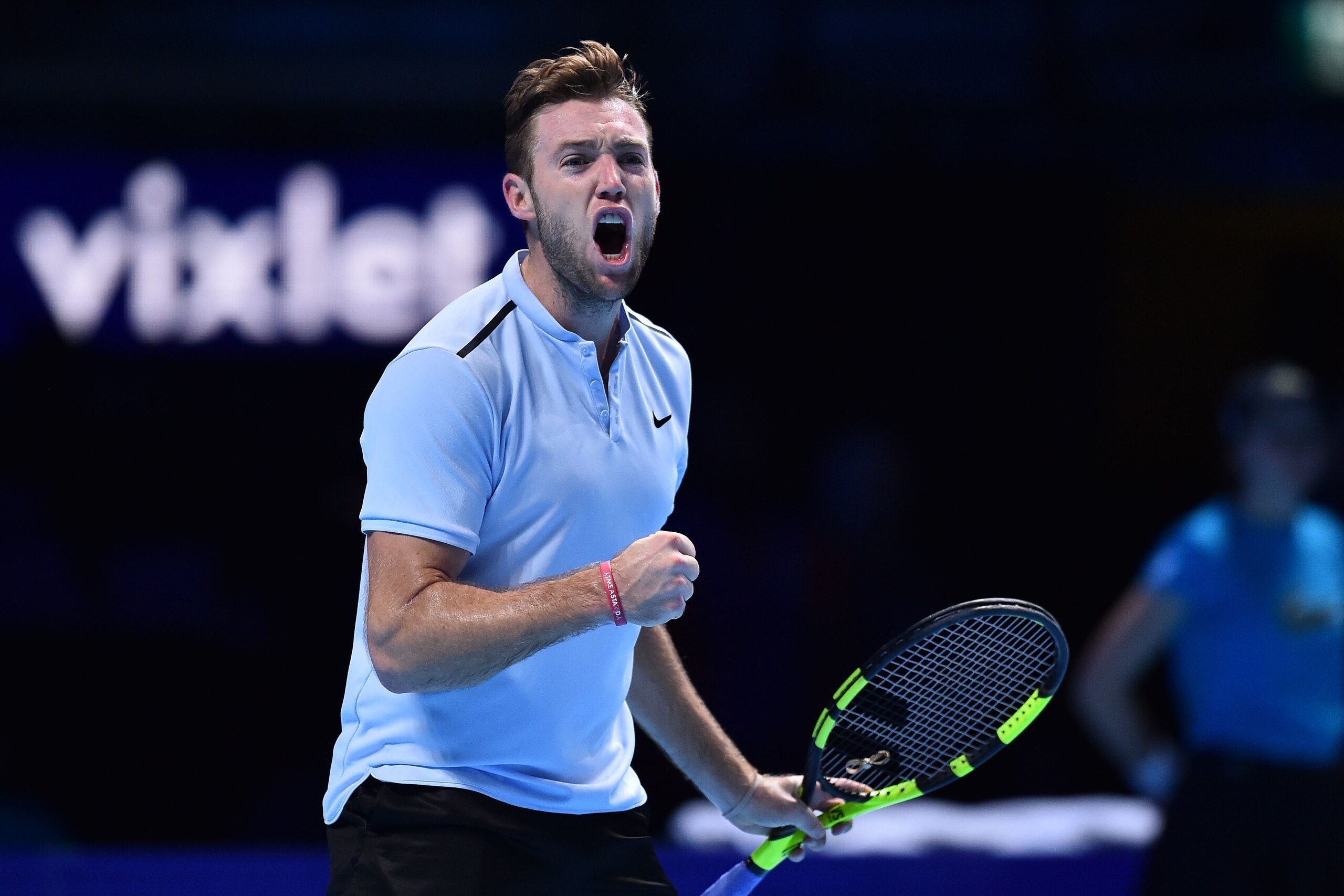 US player Jack Sock reacts to winning the second game of the final set during his men's singles round-robin match against Germany's Alexander Zverev on day five of the ATP World Tour Finals tennis tournament at the O2 Arena in London on November 16 2017. 