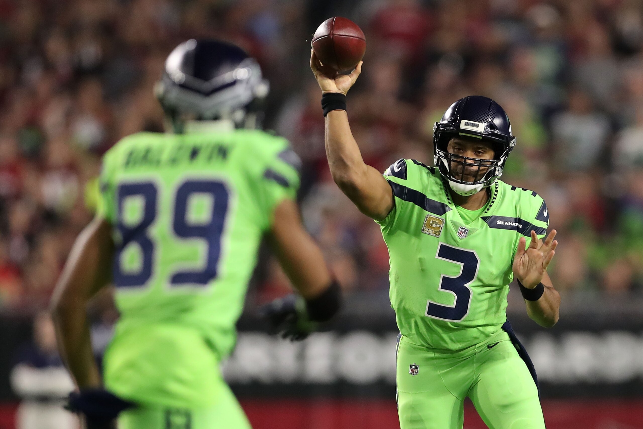 GLENDALE, AZ - NOVEMBER 09:  Quarterback Russell Wilson #3 of the Seattle Seahawks looks to make the pass to wide receiver Doug Baldwin #89 in the first half against the Arizona Cardinals at University of Phoenix Stadium on November 9, 2017 in Glendale, A