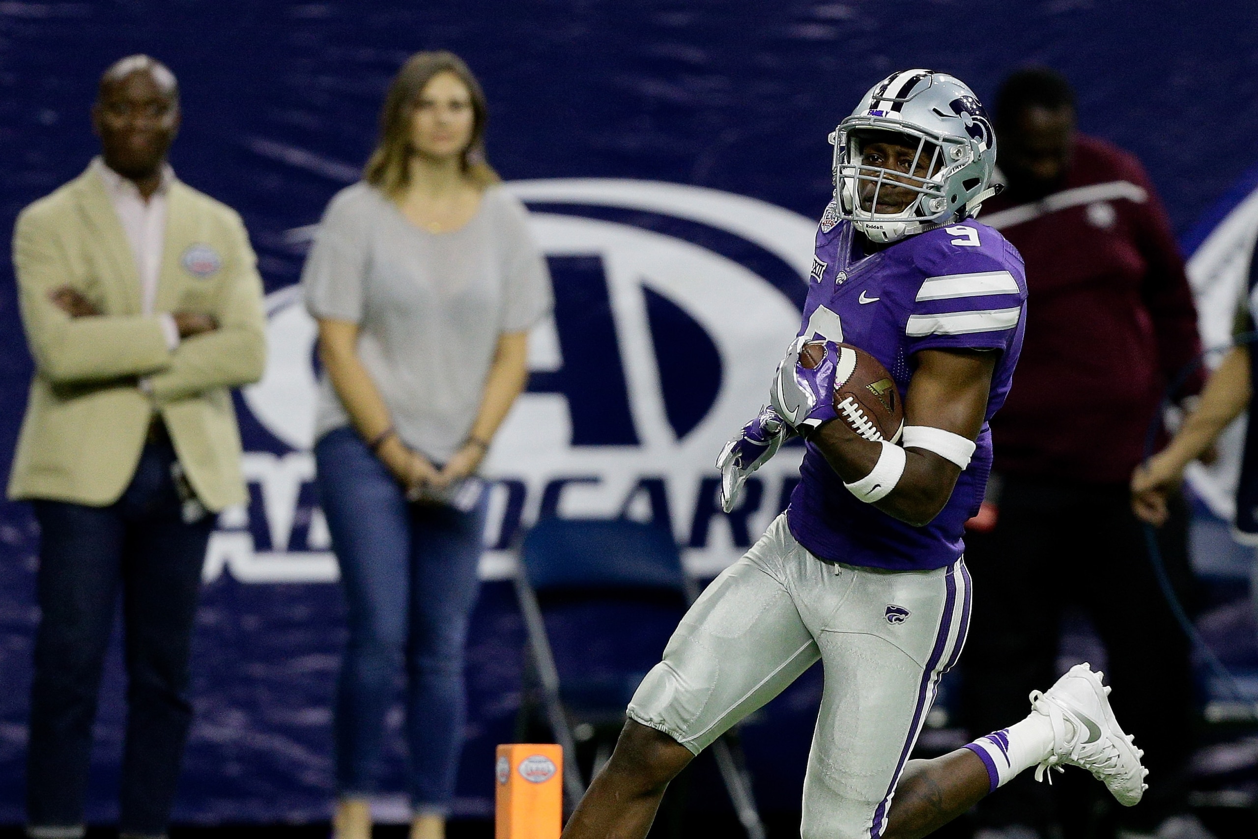 HOUSTON, TX - DECEMBER 28:  Byron Pringle #9 of the Kansas State Wildcats celebrates after a 79 yard touchdown reception against the Texas A&M Aggies in the AdvoCare V100 Texas Bowl on December 28, 2016 in Houston, Texas.  (Photo by Bob Levey/Getty Images