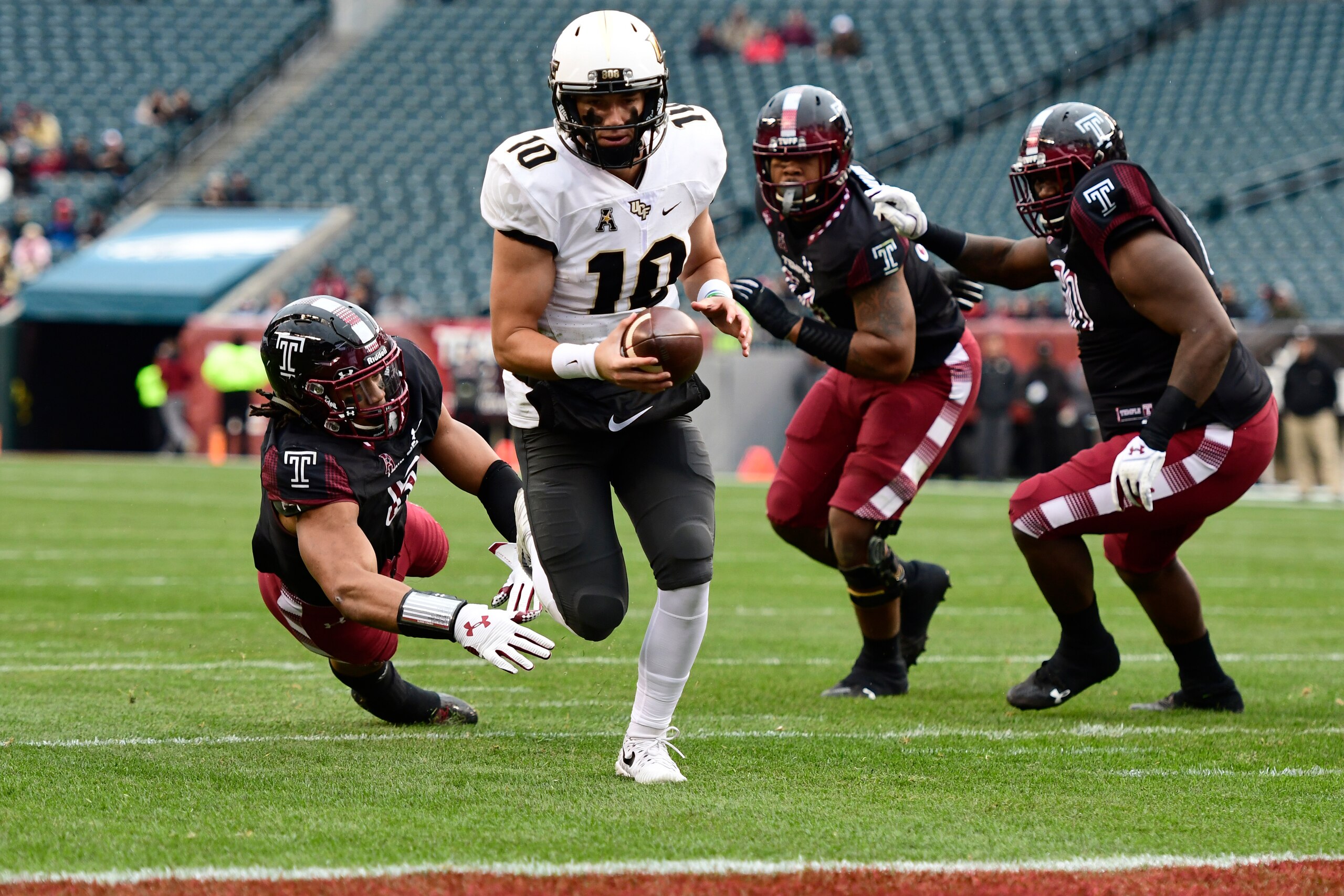 PHILADELPHIA, PA - NOVEMBER 18: McKenzie Milton #10 of the UCF Knights walks in for the first touchdown of the game against the Temple Owls during the first quarter at Lincoln Financial Field on November 18, 2017 in Philadelphia, Pennsylvania. (Photo by C