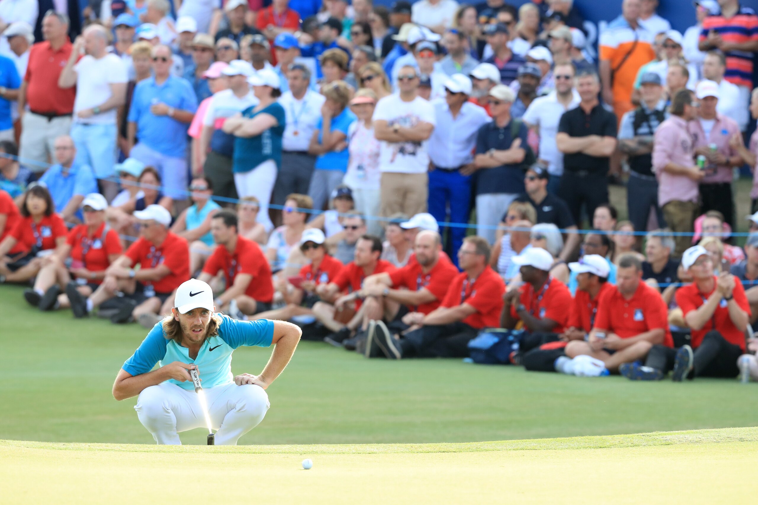 DUBAI, UNITED ARAB EMIRATES - NOVEMBER 19:  Tommy Fleetwood of England lines up a putt on the 18th green during the final round of the DP World Tour Championship at Jumeirah Golf Estates on November 19, 2017 in Dubai, United Arab Emirates.  (Photo by Andr