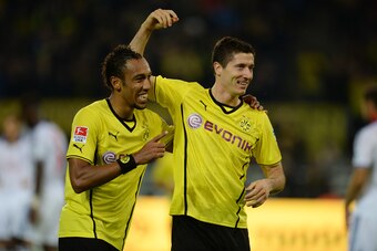 Dortmund's Gabonese striker Pierre-Emerick Aubameyang (L) and Dortmund's Polish striker Robert Lewandowski  celebrate after winning the German first division Bundesliga football match Borussia Dortmund vs Hamburger SV in Dortmund, western Germany, on Sept