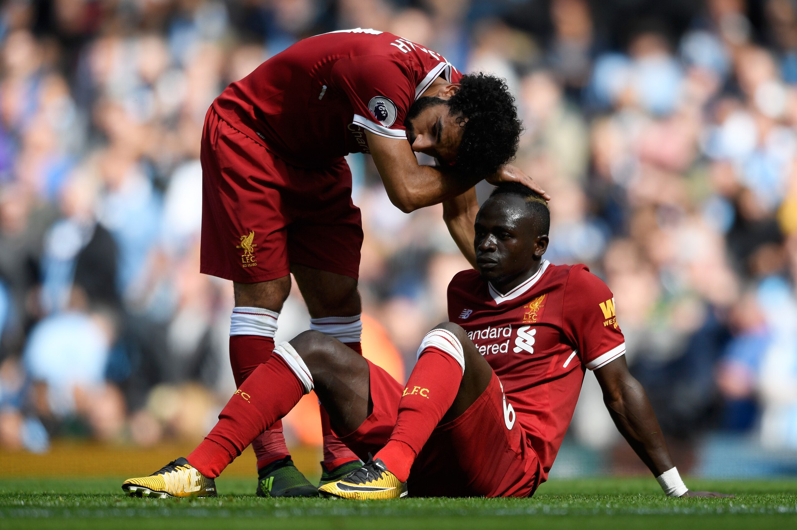 MANCHESTER, ENGLAND - SEPTEMBER 09: Mohamed Salah of Liverpool comforts Sadio Mane of Liverpool after he reacts to being sent off during the Premier League match between Manchester City and Liverpool at Etihad Stadium on September 9, 2017 in Manchester, E