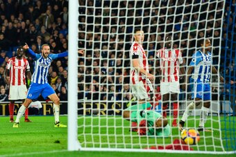 Brighton's Spanish midfielder Jose Izquierdo (R) turns away after scoring an equalising goal for 2-2 during the English Premier League football match between Brighton and Hove Albion and Stoke City at the American Express Community Stadium in Brighton, so