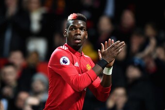 MANCHESTER, ENGLAND - NOVEMBER 18:  Paul Pogba of Manchester United celebrates when Romelu Lukaku (not pictured) scores their sides fourth goal during the Premier League match between Manchester United and Newcastle United at Old Trafford on November 18, 