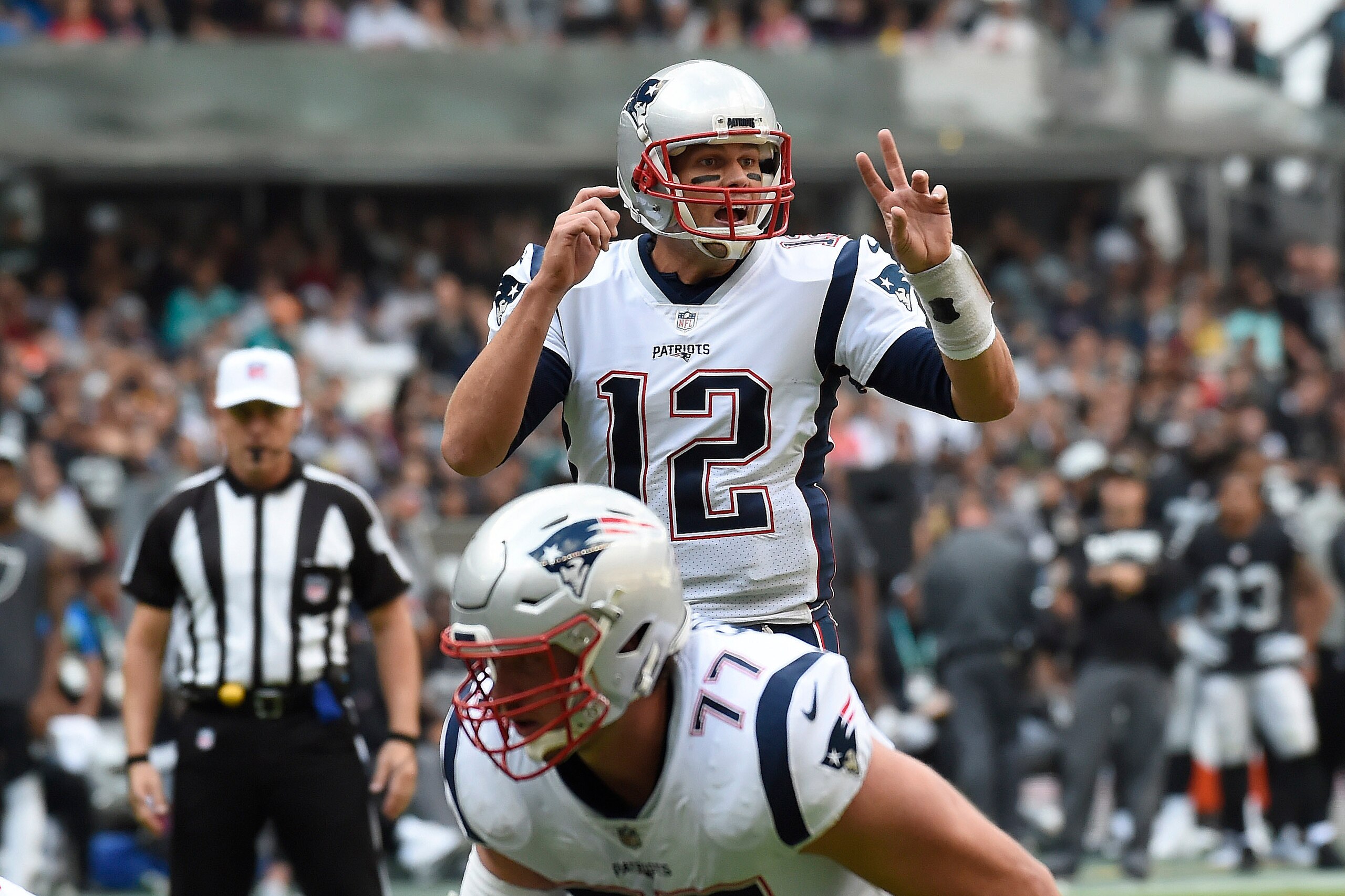 New England Patriots' Tom Brady gives instructions during the 2016 NFL week 11 regular season football game against Oakland Raiders on November 19, 2017 at the Azteca Stadium in Mexico City. / AFP PHOTO / ALFREDO ESTRELLA        (Photo credit should read 