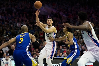 PHILADELPHIA, PA - NOVEMBER 18: Ben Simmons #25 of the Philadelphia 76ers passes the ball against the Golden State Warriors at Wells Fargo Center on November 18, 2017 in Philadelphia,Pennsylvania. NOTE TO USER: User expressly acknowledges and agrees that,