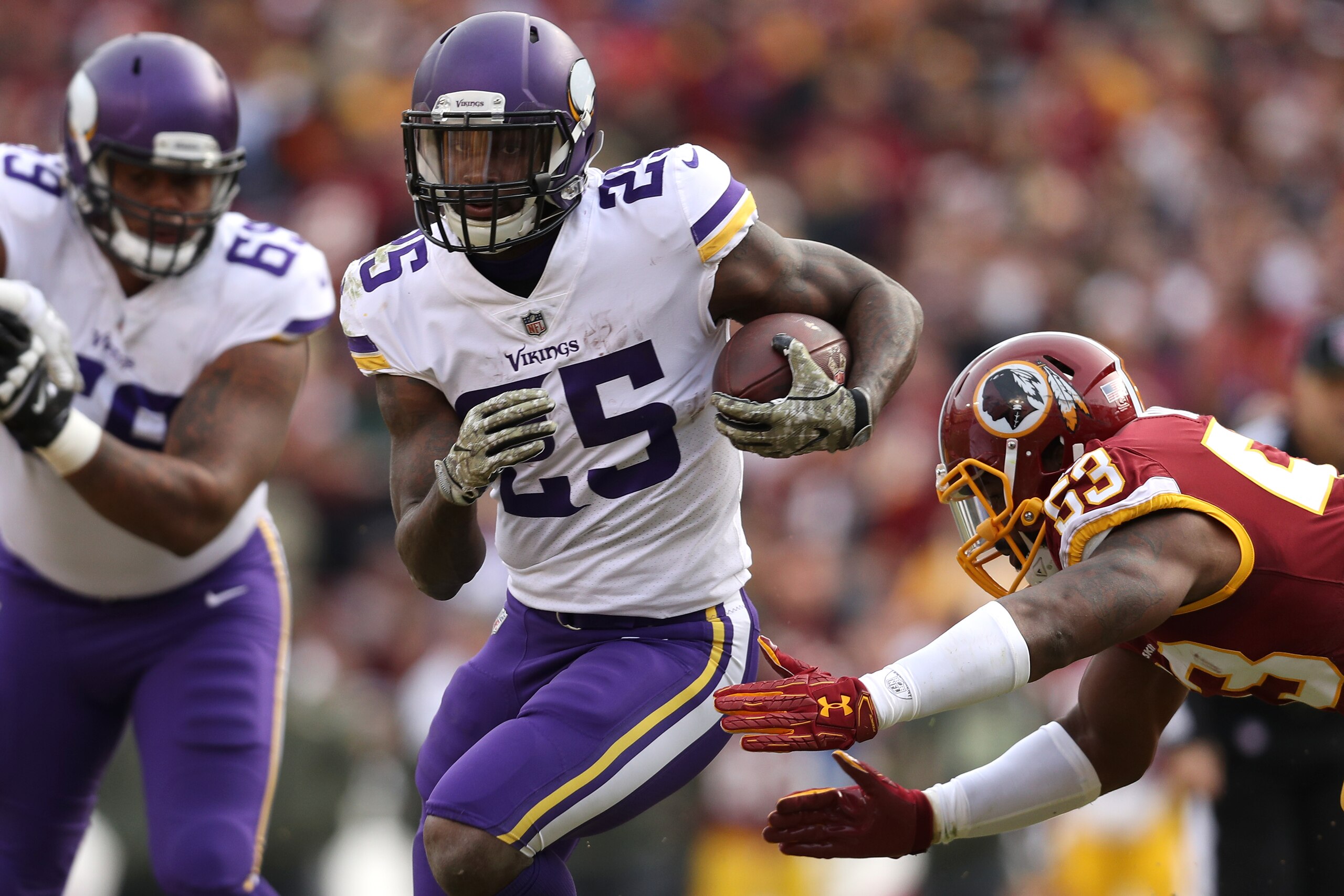LANDOVER, MD - NOVEMBER 12:Running back Latavius Murray #25 of the Minnesota Vikings runs the ball upfield during the second quarter against the Washington Redskins  at FedExField on November 12, 2017 in Landover, Maryland. (Photo by Patrick Smith/Getty I