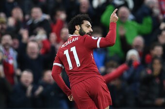 Liverpool's Egyptian midfielder Mohamed Salah celebrates scoring his team's first goal during the English Premier League football match between Liverpool and Southampton at Anfield in Liverpool, north west England on November 18, 2017. / AFP PHOTO / Paul 