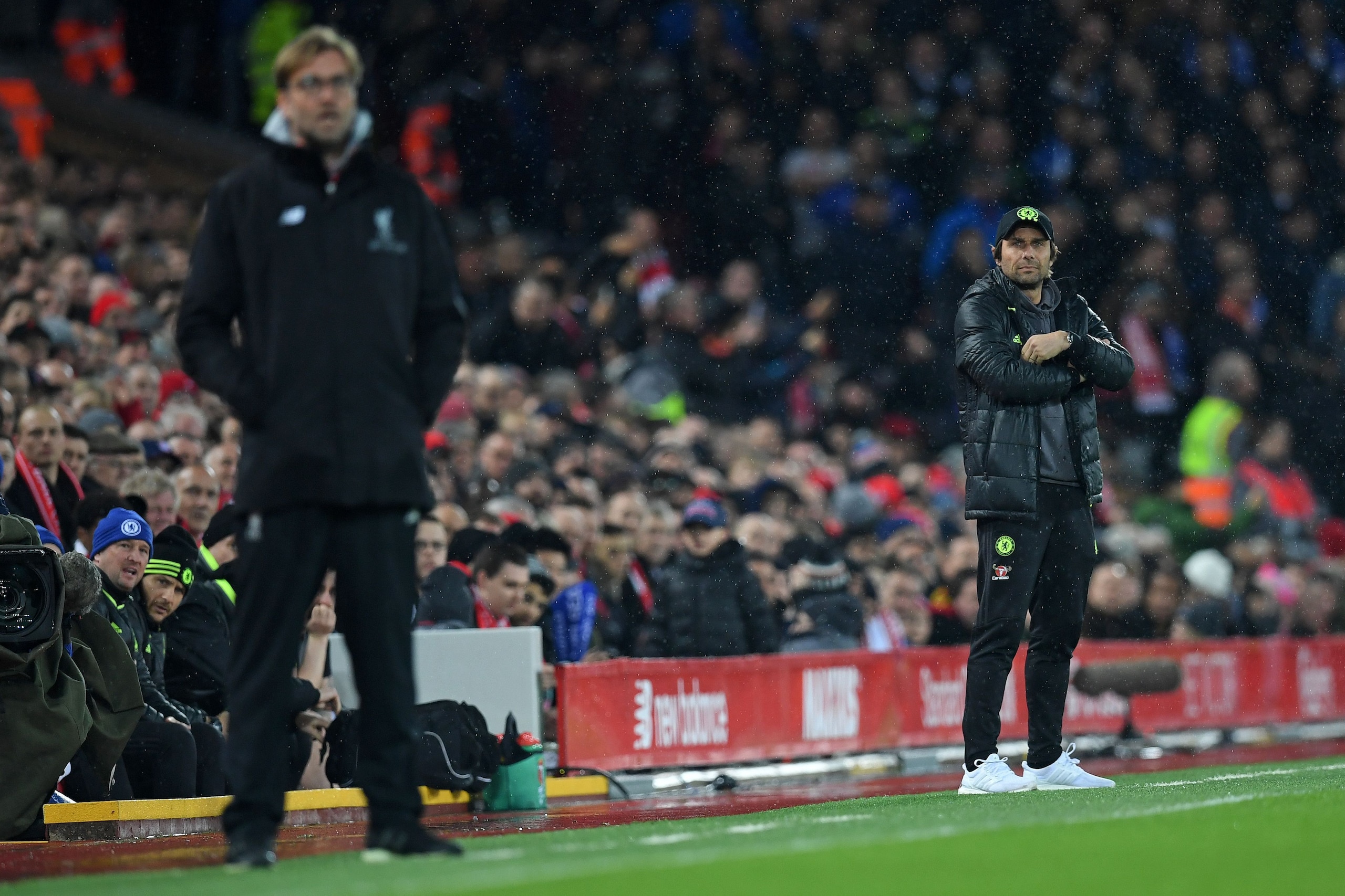 Liverpool's German manager Jurgen Klopp (L) and Chelsea's Italian head coach Antonio Conte watch the players from the touchline during the English Premier League football match between Liverpool and Chelsea at Anfield in Liverpool, north west England on J