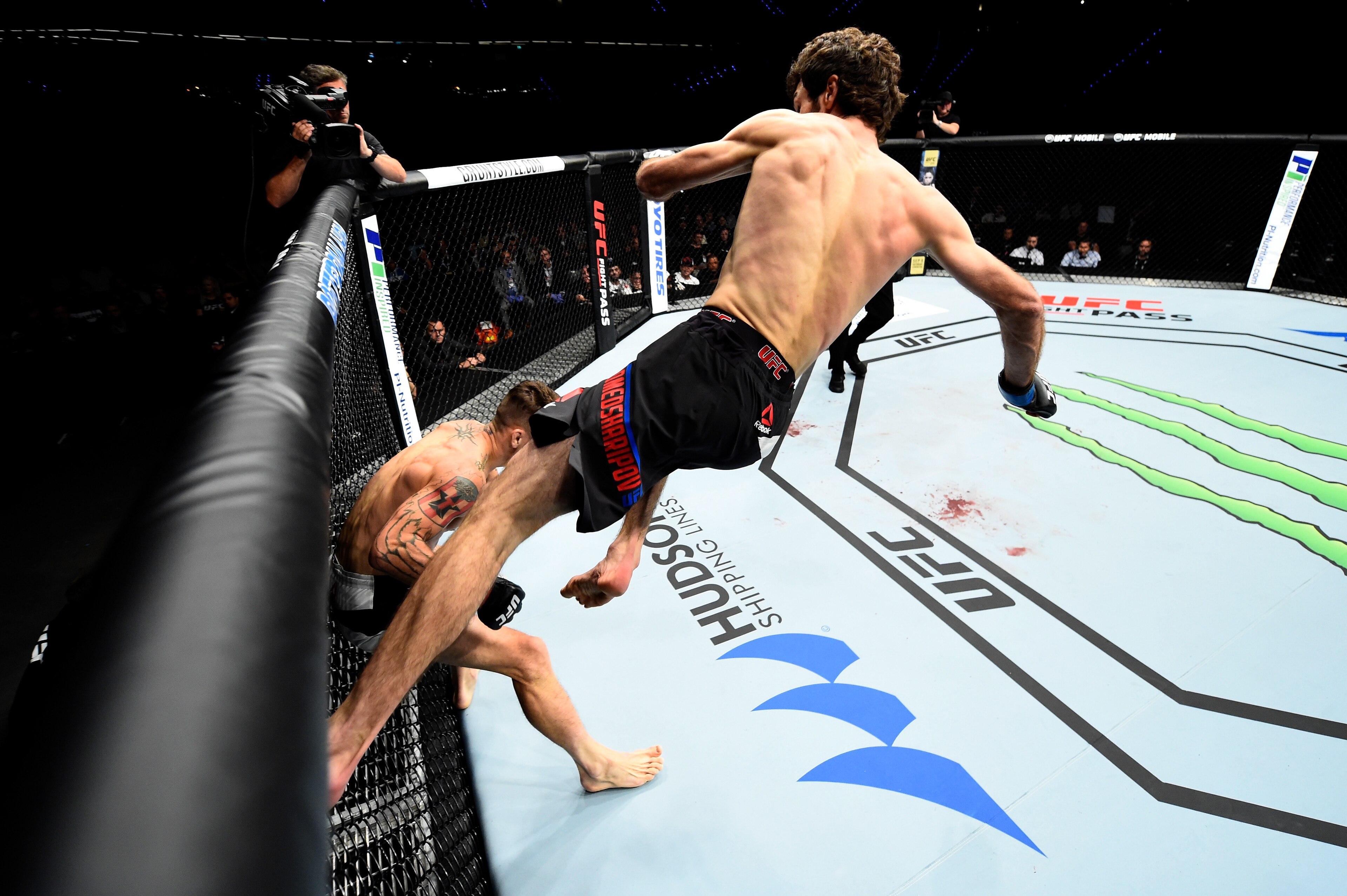 ROTTERDAM, NETHERLANDS - SEPTEMBER 02:  (R-L) Zabit Magomedsharipov of Russia jumps off the wall of the Octagon to kick Mike Santiago in their featherweight bout during the UFC Fight Night event at the Rotterdam Ahoy on September 2, 2017 in Rotterdam, Net