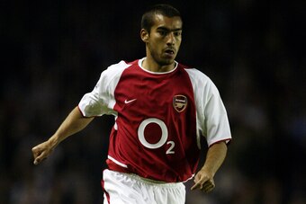 LONDON - MAY 7:   Giovanni van Bronckhorst of Arsenal running with the ball during the FA Barclaycard Premiership match between Arsenal and Southampton on May 7, 2003 at Highbury Stadium in London, England.  Arsenal won the match 6-1. (Photo by Mark Thomp