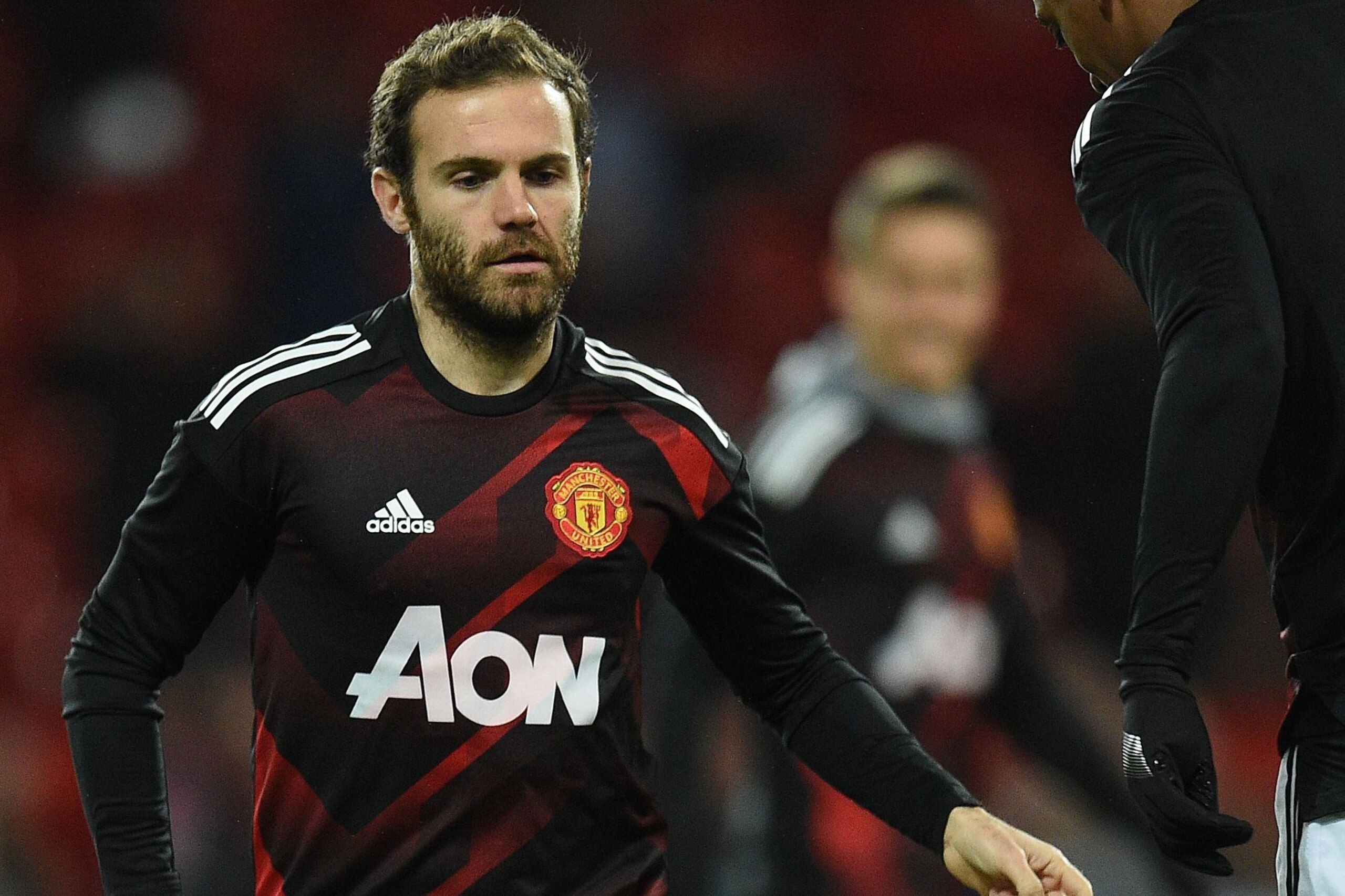 Manchester United's Spanish midfielder Juan Mata warms up ahead of the English Premier League football match between Manchester United and Newcastle at Old Trafford in Manchester, north west England, on November 18, 2017. / AFP PHOTO / Oli SCARFF / RESTRI