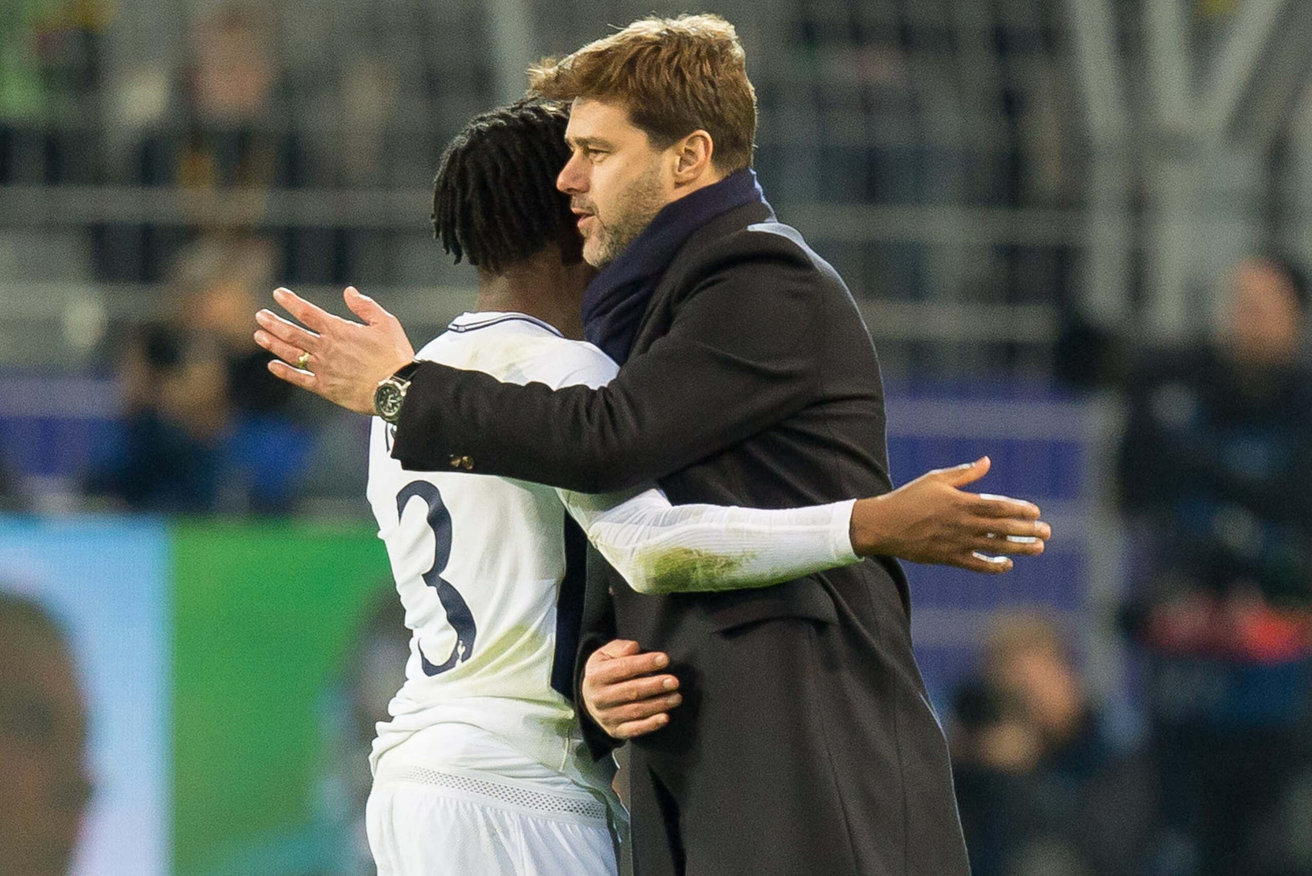 DORTMUND, GERMANY - NOVEMBER 21: Danny Rose of Tottenham Hotspur hugs Head coach Mauricio Pochettino of Tottenham Hotspur after the UEFA Champions League group H match between Borussia Dortmund and Tottenham Hotspur at Signal Iduna Park on November 21, 20