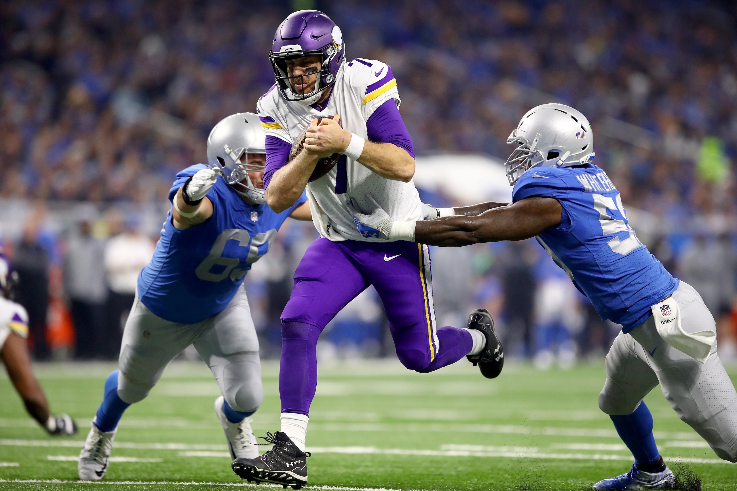 DETROIT, MI - NOVEMBER 23: Quarterback Case Keenum #7 of the Minnesota Vikings runs with the ball against Anthony Zettel #69 of the Detroit Lions and Tahir Whitehead #59 for a touchdown against the Detroit Lions during the first half at Ford Field on Nove