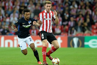 Hertha BSC Berlin's Austrian midfielder Valentino Lazaro (L) vies with Athletic Bilbao's French defender Aymeric Laporte during the Europa League football match Athletic Club Bilbao vs Hertha BSC Berlin at the San Mames stadium in Bilbao on November 23, 2