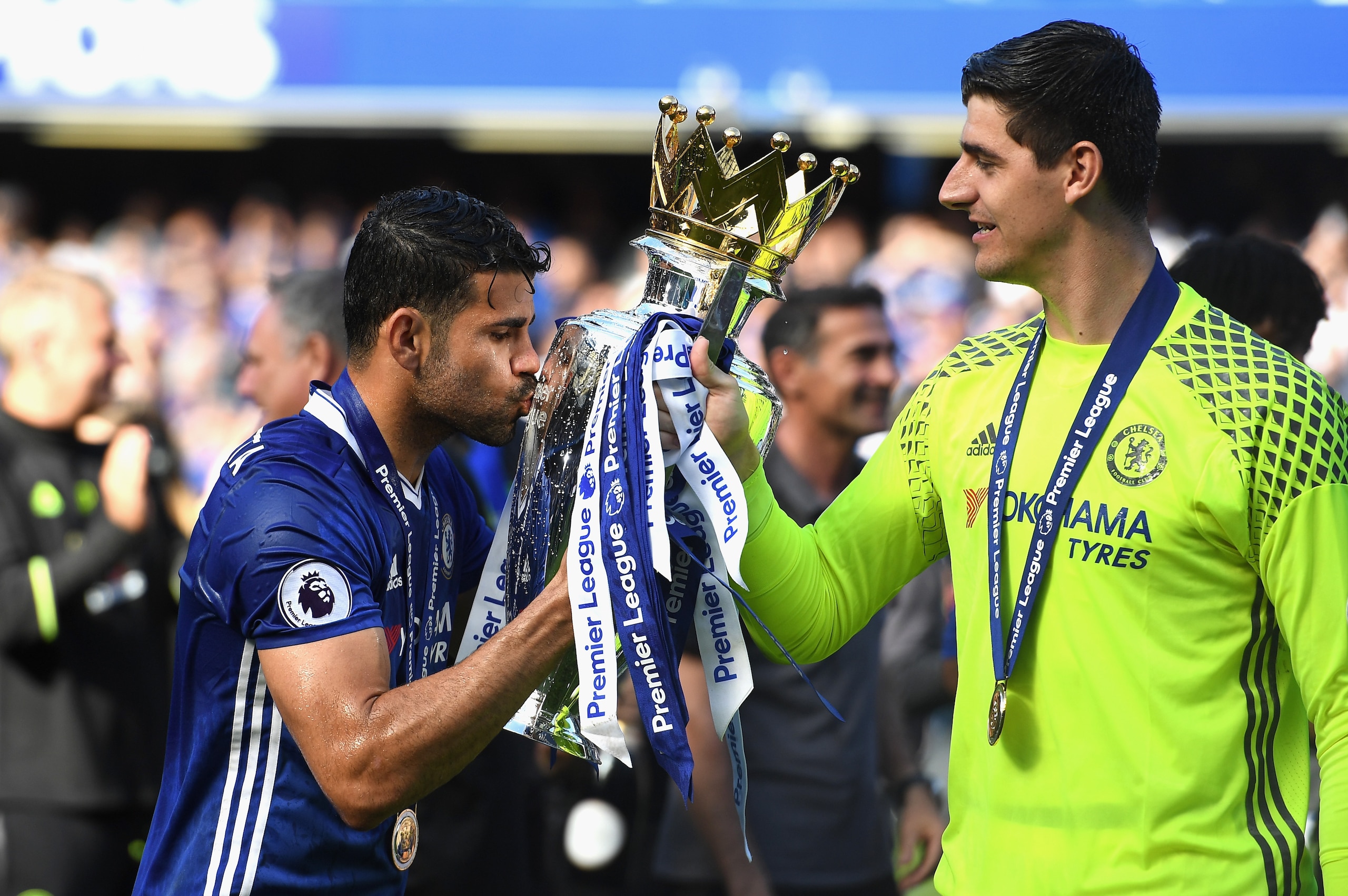 LONDON, ENGLAND - MAY 21:  Diego Costa of Chelsea and Thibaut Courtois of Chelsea celebrate with the Premier League Trophy after the Premier League match between Chelsea and Sunderland at Stamford Bridge on May 21, 2017 in London, England.  (Photo by Shau