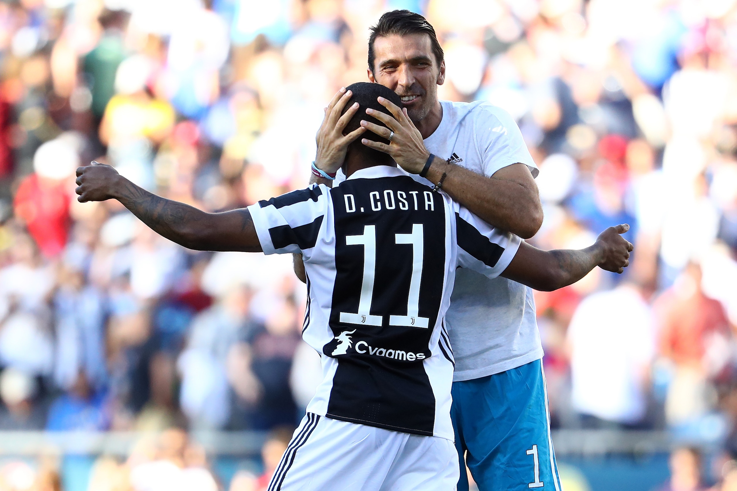 FOXBORO, MA - JULY 30: Douglas Costa #11 of Juventus celebrates with Gianluigi Buffon #1 after scoring the game winning goal during penalty kicks to defeat Roma during the International Champions Cup 2017 match at Gillette Stadium on July 30, 2017 in Foxb