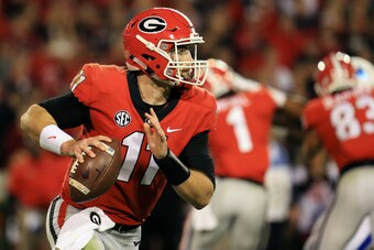 ATHENS, GA - NOVEMBER 18: Jake Fromm #11 of the Georgia Bulldogs rolls out on a pass play during the second half against the Kentucky Wildcats at Sanford Stadium on November 18, 2017 in Athens, Georgia. (Photo by Daniel Shirey/Getty Images)