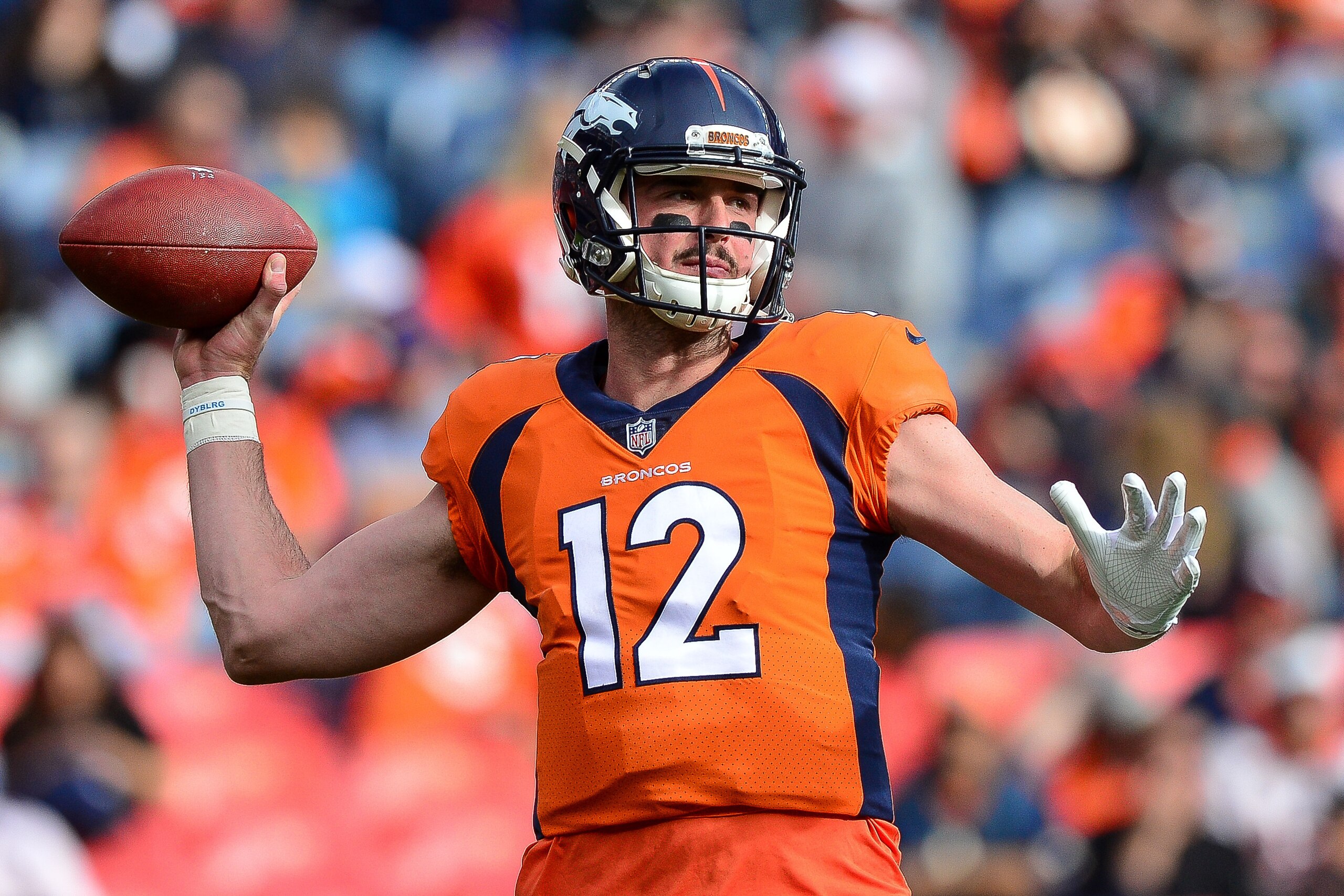 DENVER, CO - NOVEMBER 19:  Quarterback Paxton Lynch #12 of the Denver Broncos throws as he warms up before a game against the Cincinnati Bengals at Sports Authority Field at Mile High on November 19, 2017 in Denver, Colorado. (Photo by Dustin Bradford/Get