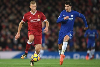 LIVERPOOL, ENGLAND - NOVEMBER 25:  Ragnar Klavan of Liverpool and Alvaro Morata of Chelsea battle for the ball during the Premier League match between Liverpool and Chelsea at Anfield on November 25, 2017 in Liverpool, England.  (Photo by Shaun Botterill/