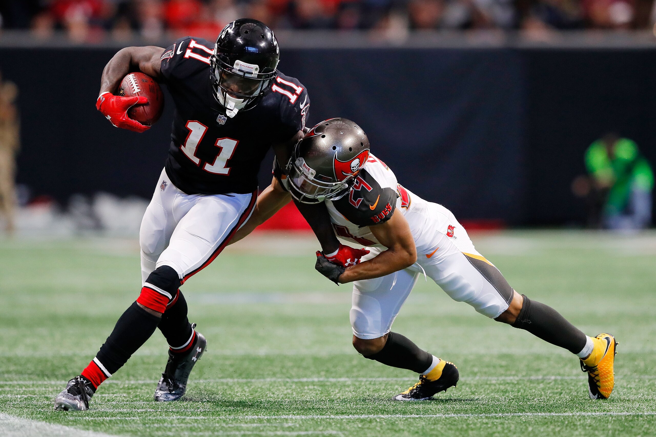 ATLANTA, GA - NOVEMBER 26: Julio Jones #11 of the Atlanta Falcons is tackled by Brent Grimes #24 of the Tampa Bay Buccaneers during the second half at Mercedes-Benz Stadium on November 26, 2017 in Atlanta, Georgia. (Photo by Kevin C.  Cox/Getty Images)
