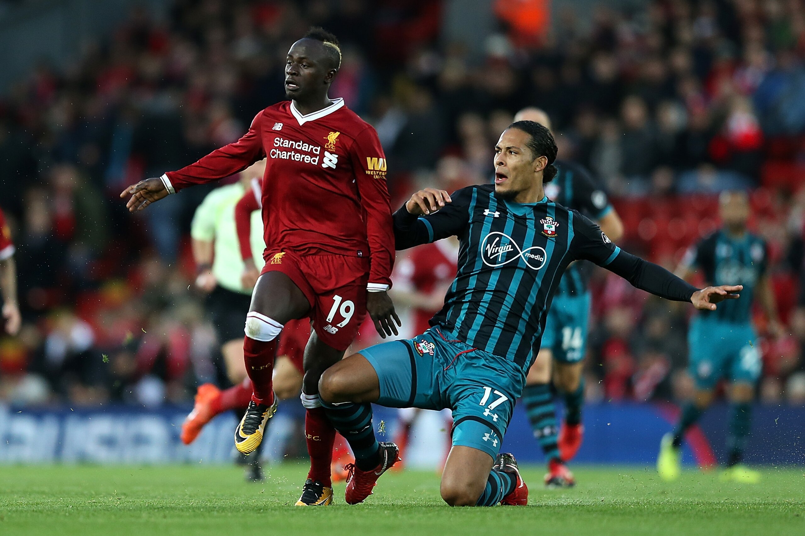 LIVERPOOL, ENGLAND - NOVEMBER 18:  Virgil van Dijk of Southampton battles with Sadio Mane of Liverpool during the Premier League match between Liverpool and Southampton at Anfield on November 18, 2017 in Liverpool, England.  (Photo by Jan Kruger/Getty Ima