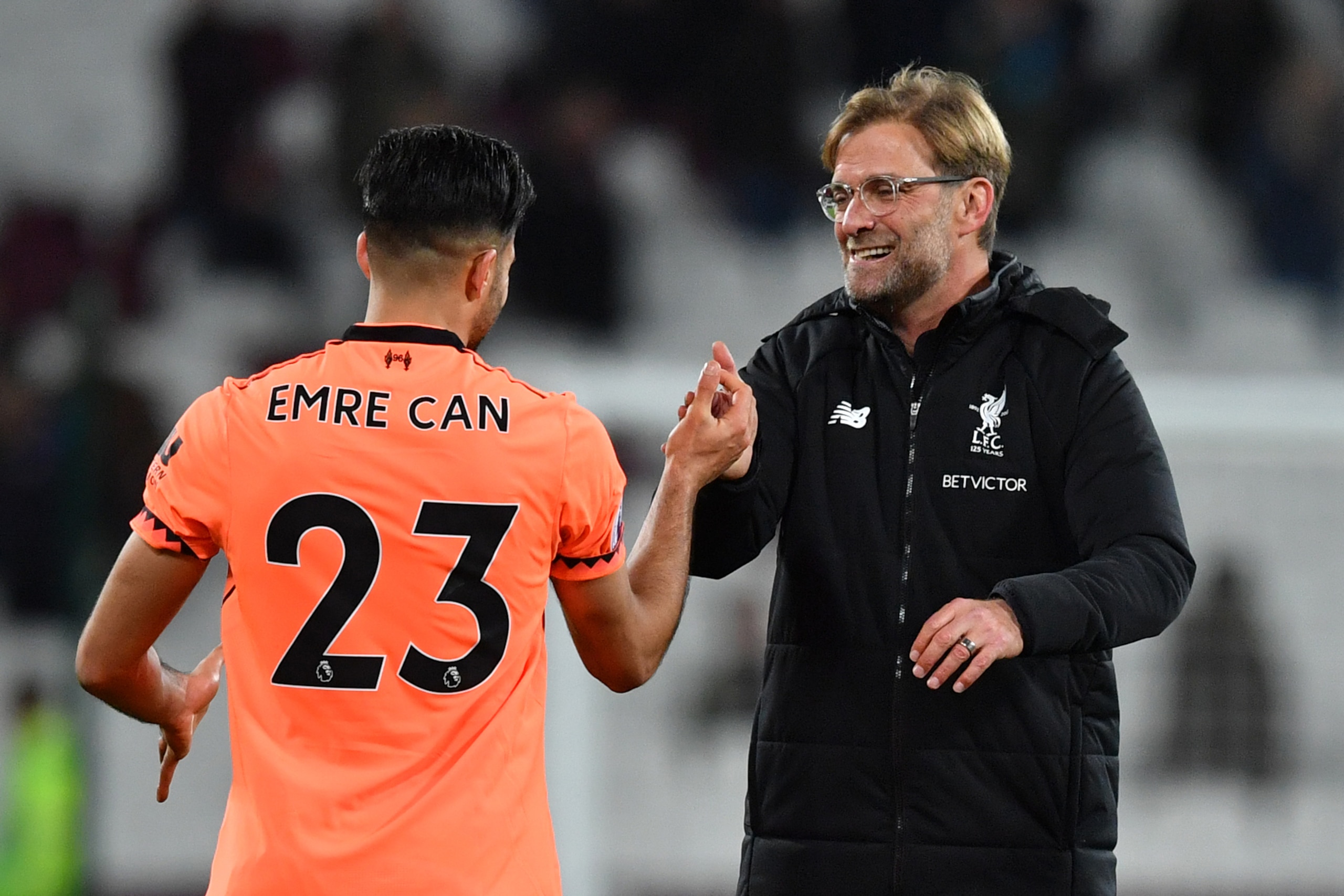Liverpool's German midfielder Emre Can (L) celebrates with Liverpool's German manager Jurgen Klopp after winning the English Premier League football match between West Ham United and Liverpool at The London Stadium, in east London on November 4, 2017. / A