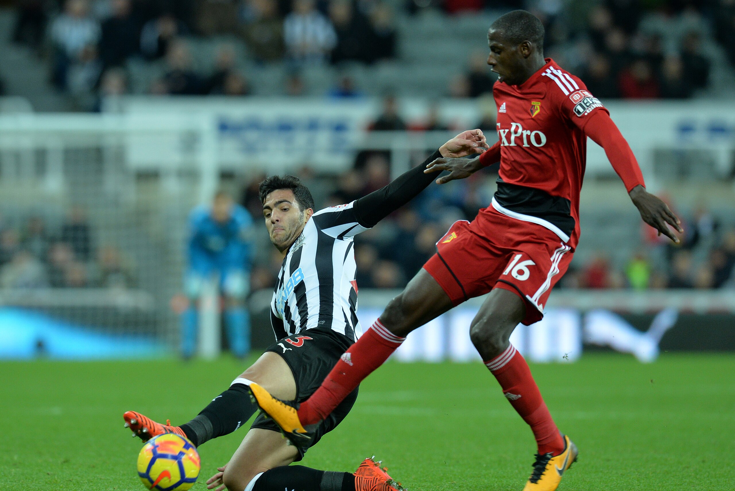 NEWCASTLE UPON TYNE, ENGLAND - NOVEMBER 25: Mikael Merino of Newcastle United is challenged by Abdoulaye Doucoure of Watford during the Premier League match between Newcastle United and Watford at St. James Park on November 25, 2017 in Newcastle upon Tyne NEWCASTLE UPON TYNE, ENGLAND - NOVEMBER 25: Mikael Merino of Newcastle United is challenged by Abdoulaye Doucoure of Watford during the Premier League match between Newcastle United and Watford at St. James Park on November 25, 2017 in Newcastle upon Tyne