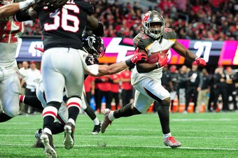 ATLANTA, GA - NOVEMBER 26: Peyton Barber #25 of the Tampa Bay Buccaneers runs the ball during the second half against the Atlanta Falcons at Mercedes-Benz Stadium on November 26, 2017 in Atlanta, Georgia. (Photo by Scott Cunningham/Getty Images)
