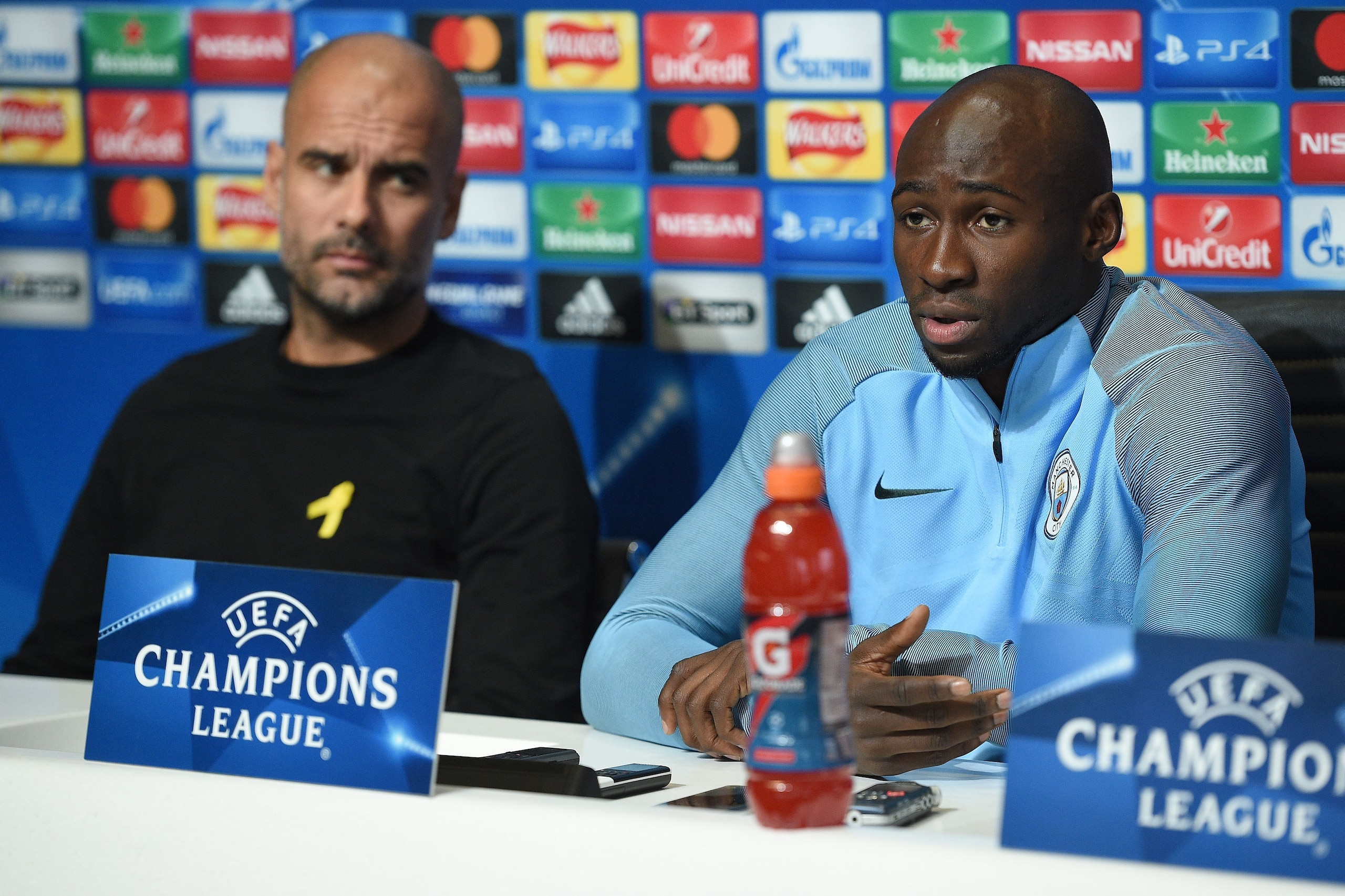 Manchester City's Spanish manager Pep Guardiola (L) and Manchester City's French defender Eliaquim Mangala attend a press conference at the City Football Academy in Manchester, north west England on November 20, 2017, on the eve of their UEFA Champions Le