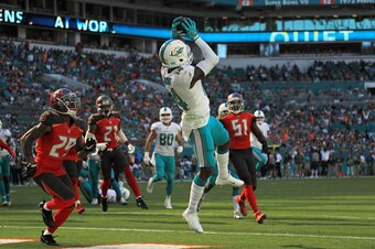 MIAMI GARDENS, FL - NOVEMBER 19: Jarvis Landry #14 of the Miami Dolphins catches the ball for a touchdown during the first quarter against the Tampa Bay Buccaneers at Hard Rock Stadium  on November 19, 2017 in Miami Gardens, Florida.  (Photo by Mike Ehrma