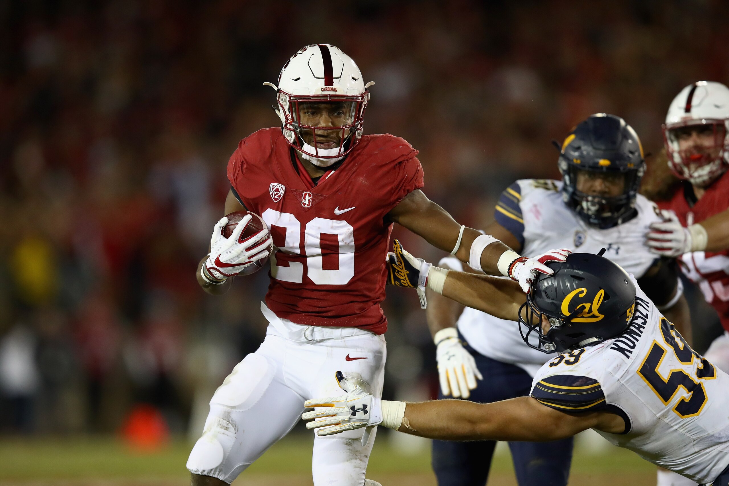 PALO ALTO, CA - NOVEMBER 18:  Bryce Love #20 of the Stanford Cardinal runs with the ball against the California Golden Bears at Stanford Stadium on November 18, 2017 in Palo Alto, California.  (Photo by Ezra Shaw/Getty Images)