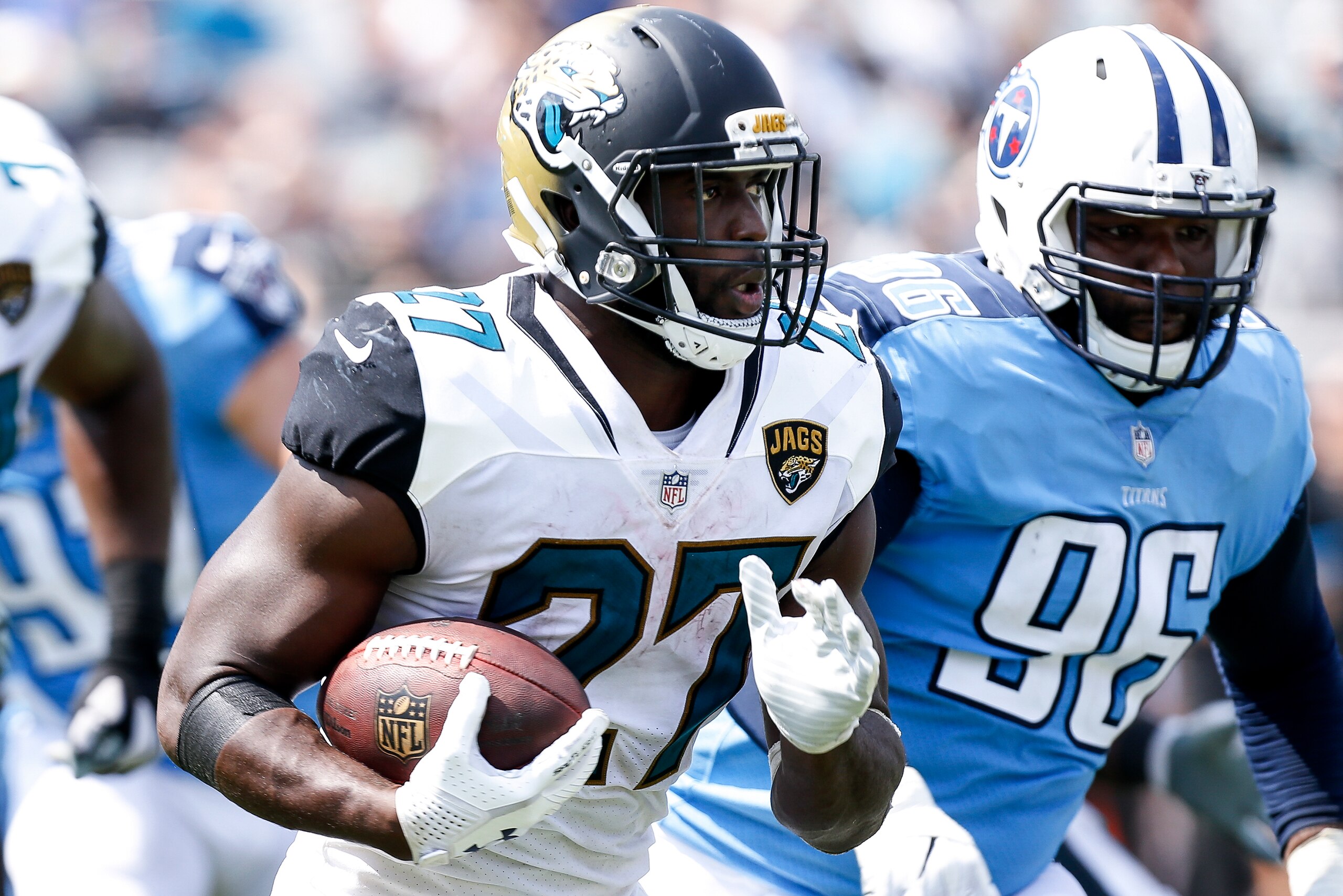 JACKSONVILLE, FL - SEPTEMBER 17: Runningback Leonard Foutnette #27 of the Jacksonville Jaguars avoids a tackle by Nose Tackle Sylvester Williams #96 of the Tennessee Titans on a run play during the game at EverBank Field on September 17, 2017 in Jacksonvi JACKSONVILLE, FL - SEPTEMBER 17: Runningback Leonard Foutnette #27 of the Jacksonville Jaguars avoids a tackle by Nose Tackle Sylvester Williams #96 of the Tennessee Titans on a run play during the game at EverBank Field on September 17, 2017 in Jacksonvi
