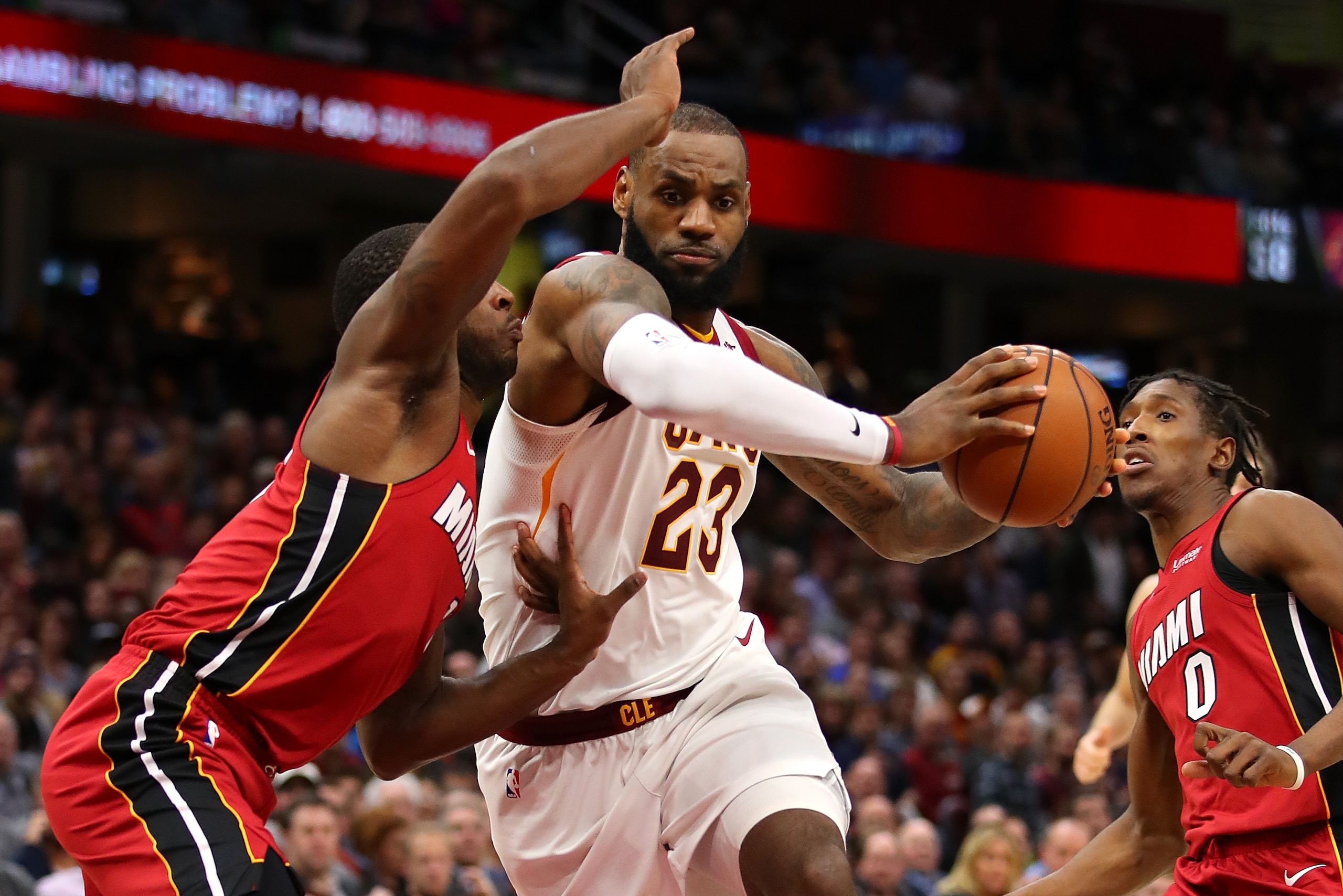 CLEVELAND, OH - NOVEMBER 28: LeBron James #23 of the Cleveland Cavaliers drives between Dion Waiters #11 and Josh Richardson #0 of the Miami Heat during the second half at Quicken Loans Arena on November 28, 2017 in Cleveland, Ohio. Cleveland won the game