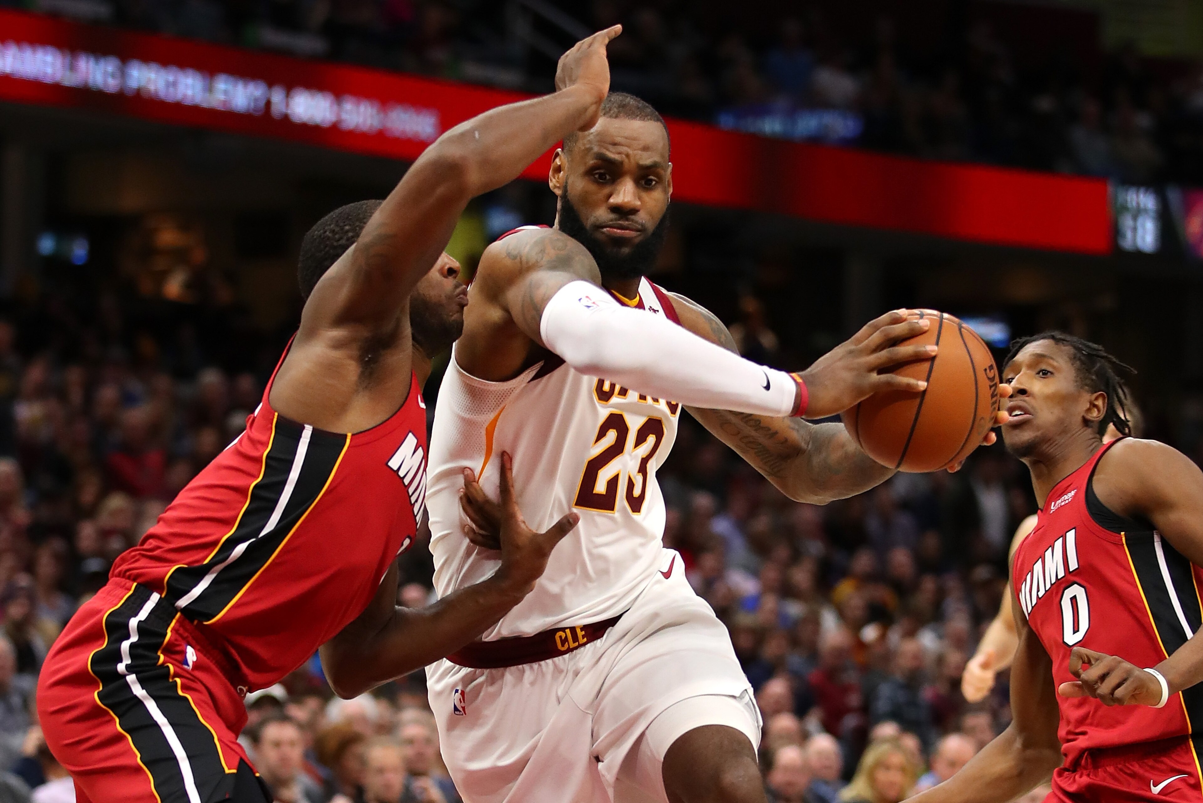 CLEVELAND, OH - NOVEMBER 28: LeBron James #23 of the Cleveland Cavaliers drives between Dion Waiters #11 and Josh Richardson #0 of the Miami Heat during the second half at Quicken Loans Arena on November 28, 2017 in Cleveland, Ohio. Cleveland won the game