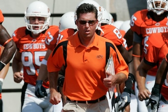 Gundy leading his team out before the "I'm 40" game in 2007.