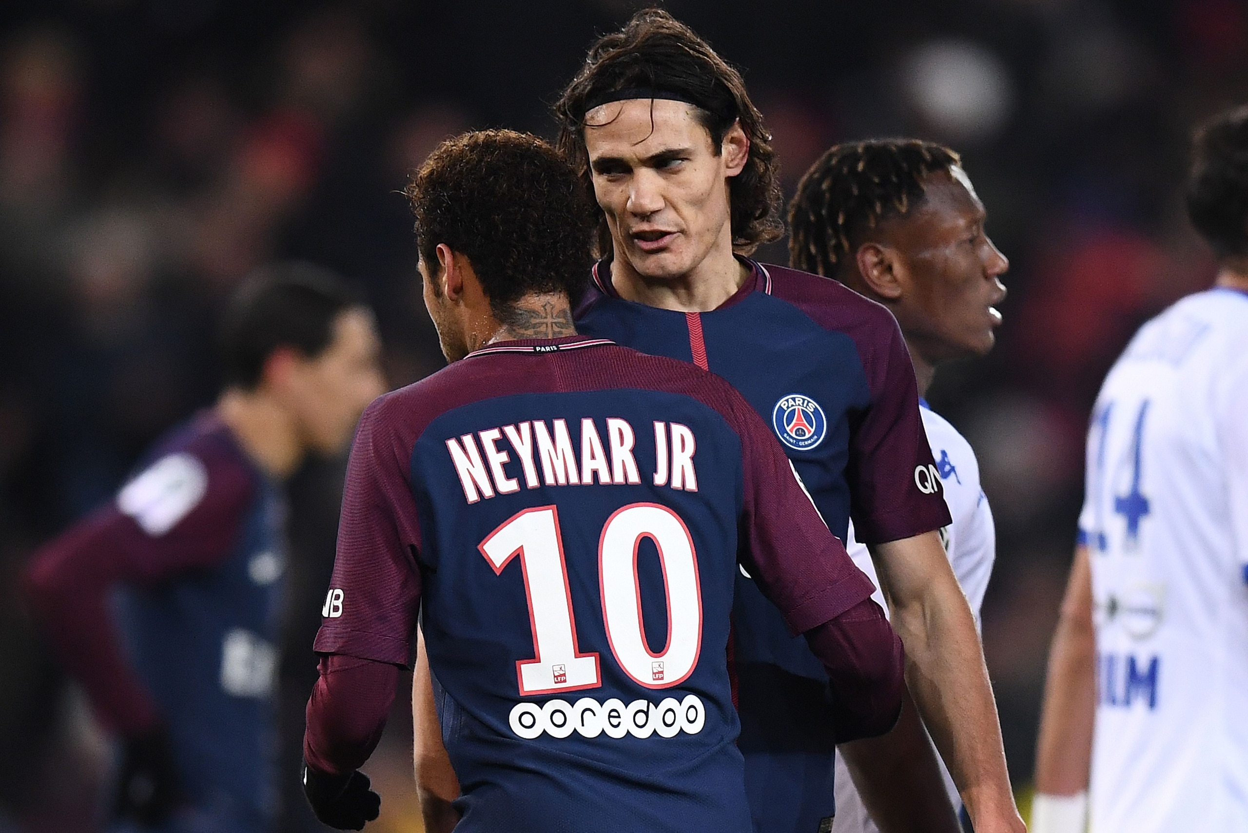 Paris Saint-Germain's Uruguayan forward Edinson Cavani (R) speaks with Paris Saint-Germain's Brazilian forward Neymar prior to kick a penalty during the French L1 football match between Paris Saint-Germain (PSG) and Troyes at the Parc des Princes stadium 