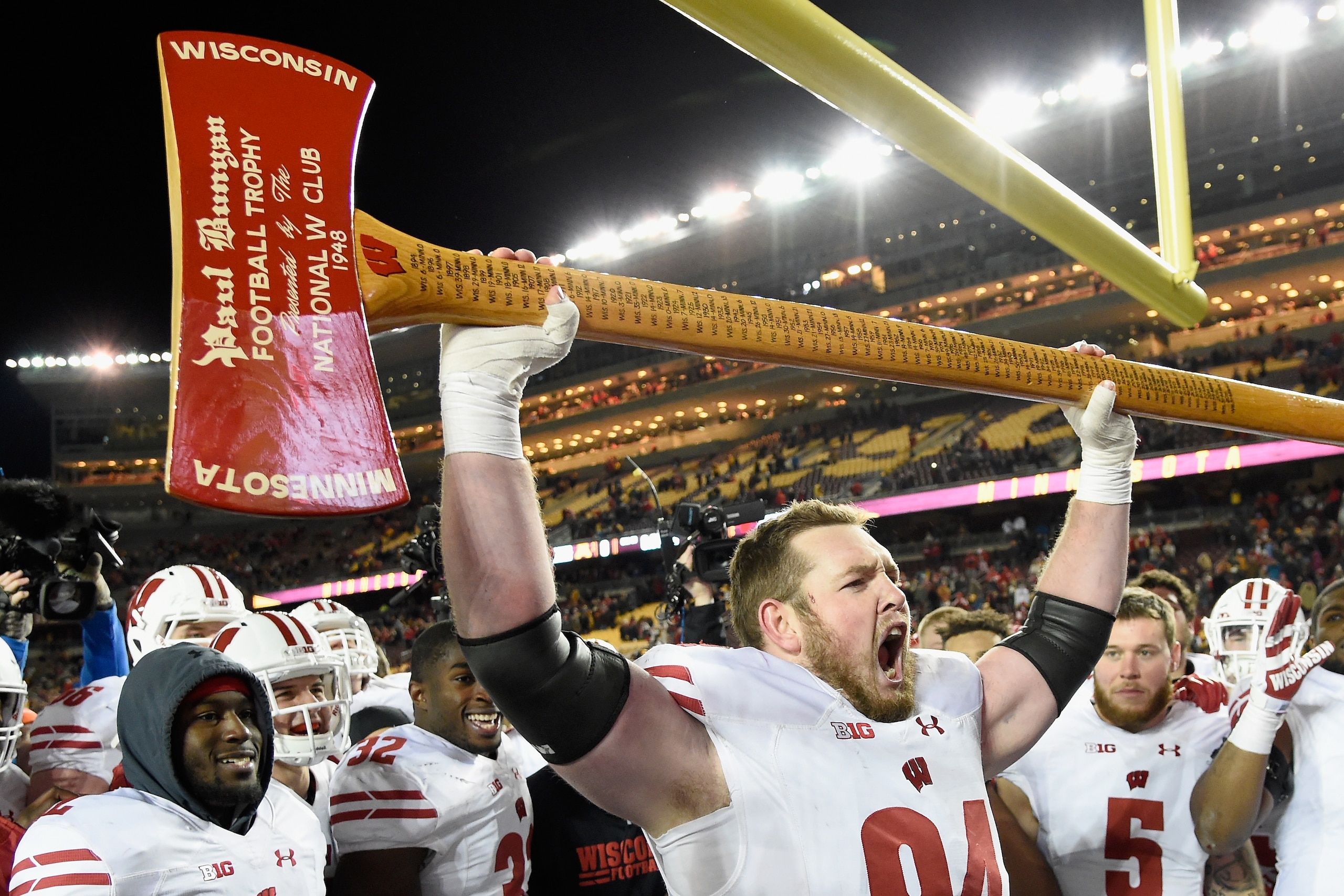 MINNEAPOLIS, MN - NOVEMBER 25: Conor Sheehy #94 of the Wisconsin Badgers celebrates with Paul Bunyan's Axe after winning the game against the Minnesota Golden Gophers on November 25, 2017 at TCF Bank Stadium in Minneapolis, Minnesota. The Badgers defeated MINNEAPOLIS, MN - NOVEMBER 25: Conor Sheehy #94 of the Wisconsin Badgers celebrates with Paul Bunyan's Axe after winning the game against the Minnesota Golden Gophers on November 25, 2017 at TCF Bank Stadium in Minneapolis, Minnesota. The Badgers defeated