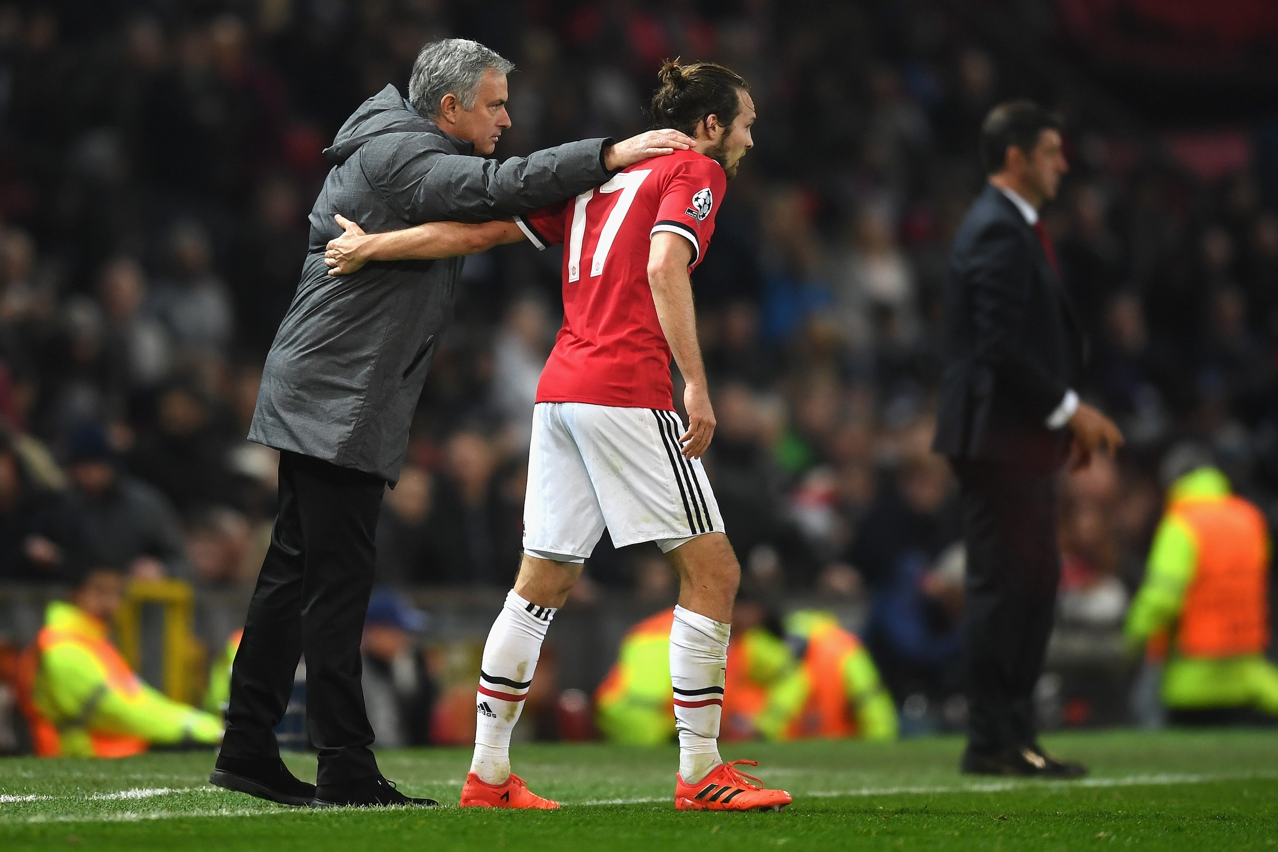 MANCHESTER, ENGLAND - OCTOBER 31: Daley Blind of Manchester United and Jose Mourinho, Manager of Manchester United embrace during the UEFA Champions League group A match between Manchester United and SL Benfica at Old Trafford on October 31, 2017 in Manch