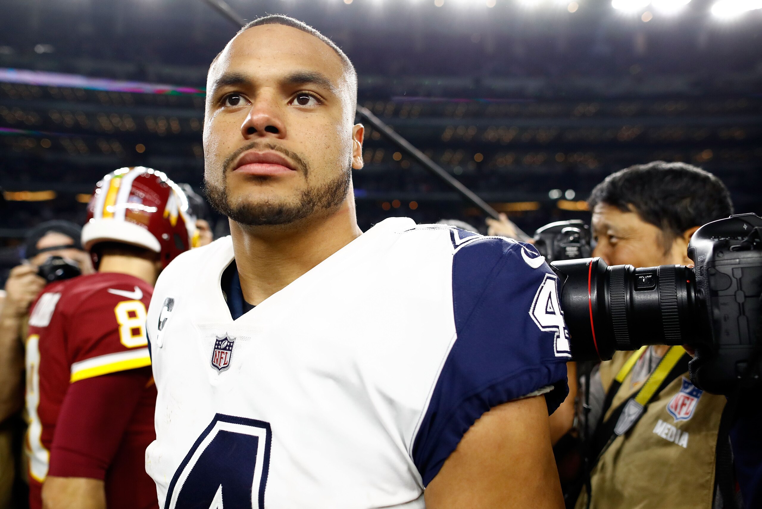 ARLINGTON, TX - NOVEMBER 30:  Dak Prescott #4 of the Dallas Cowboys walks off the field after the 38-14 win over the Washington Redskins at AT&T Stadium on November 30, 2017 in Arlington, Texas.  (Photo by Wesley Hitt/Getty Images)