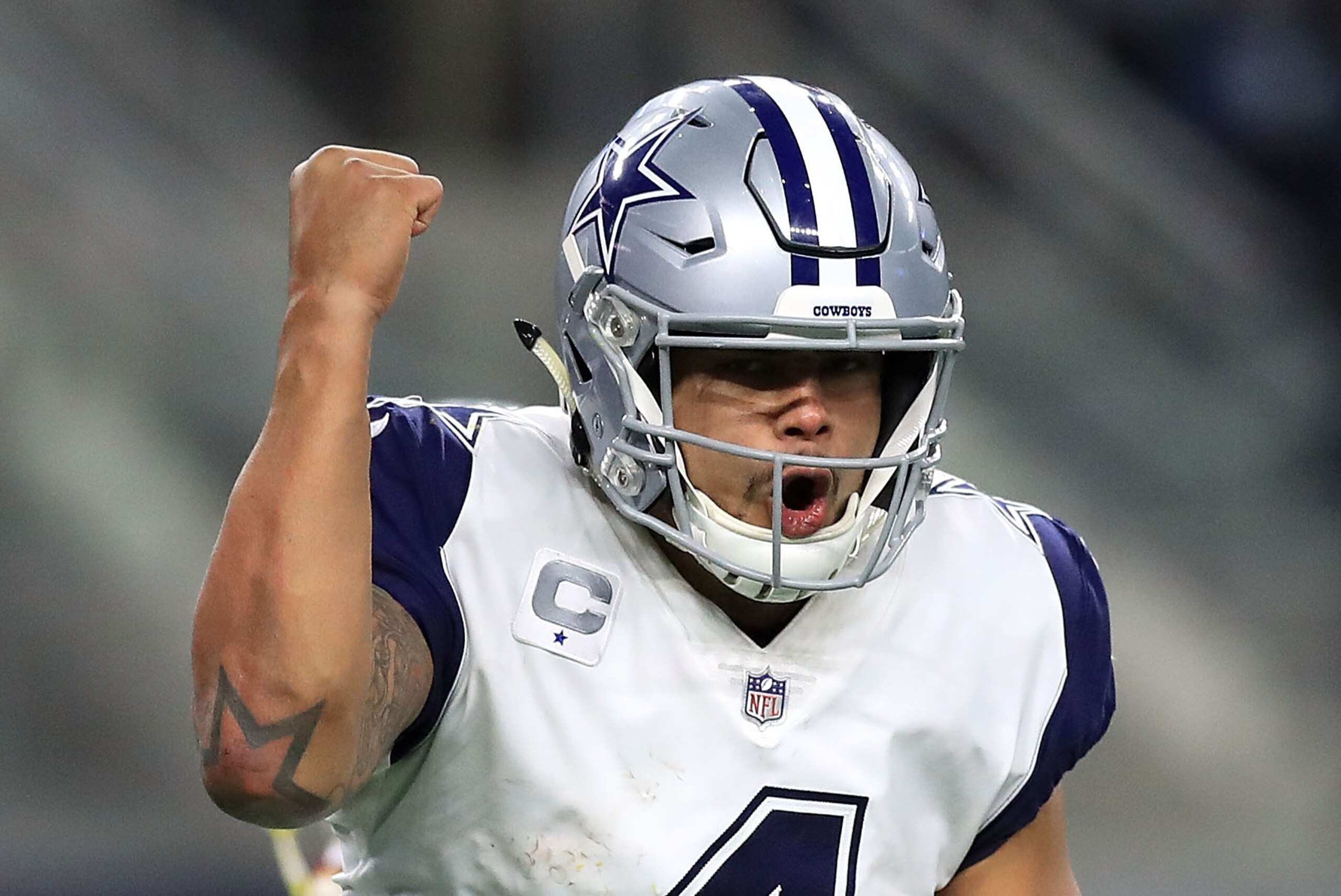 ARLINGTON, TX - NOVEMBER 30:  Dak Prescott #4 of the Dallas Cowboys celebrates a fourth quarter touchdown against the Washington Redskins at AT&T Stadium on November 30, 2017 in Arlington, Texas.  (Photo by Ronald Martinez/Getty Images)