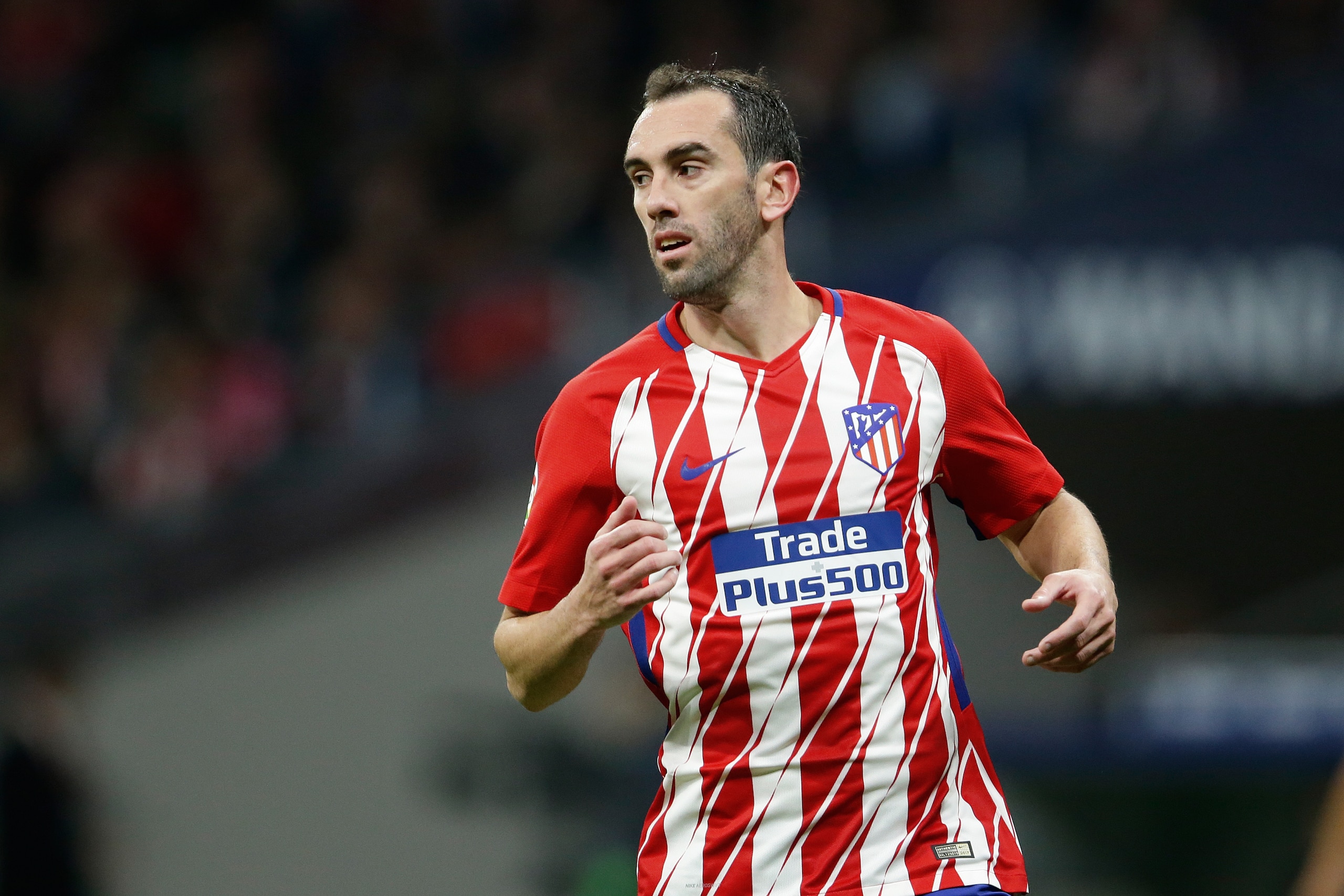 MADRID, SPAIN - NOVEMBER 18: Diego Godin of Atletico Madrid  during the Spanish Primera Division   match between Atletico Madrid v Real Madrid at the Estadio Wanda Metropolitano on November 18, 2017 in Madrid Spain (Photo by Eric Verhoeven/Soccrates/Getty