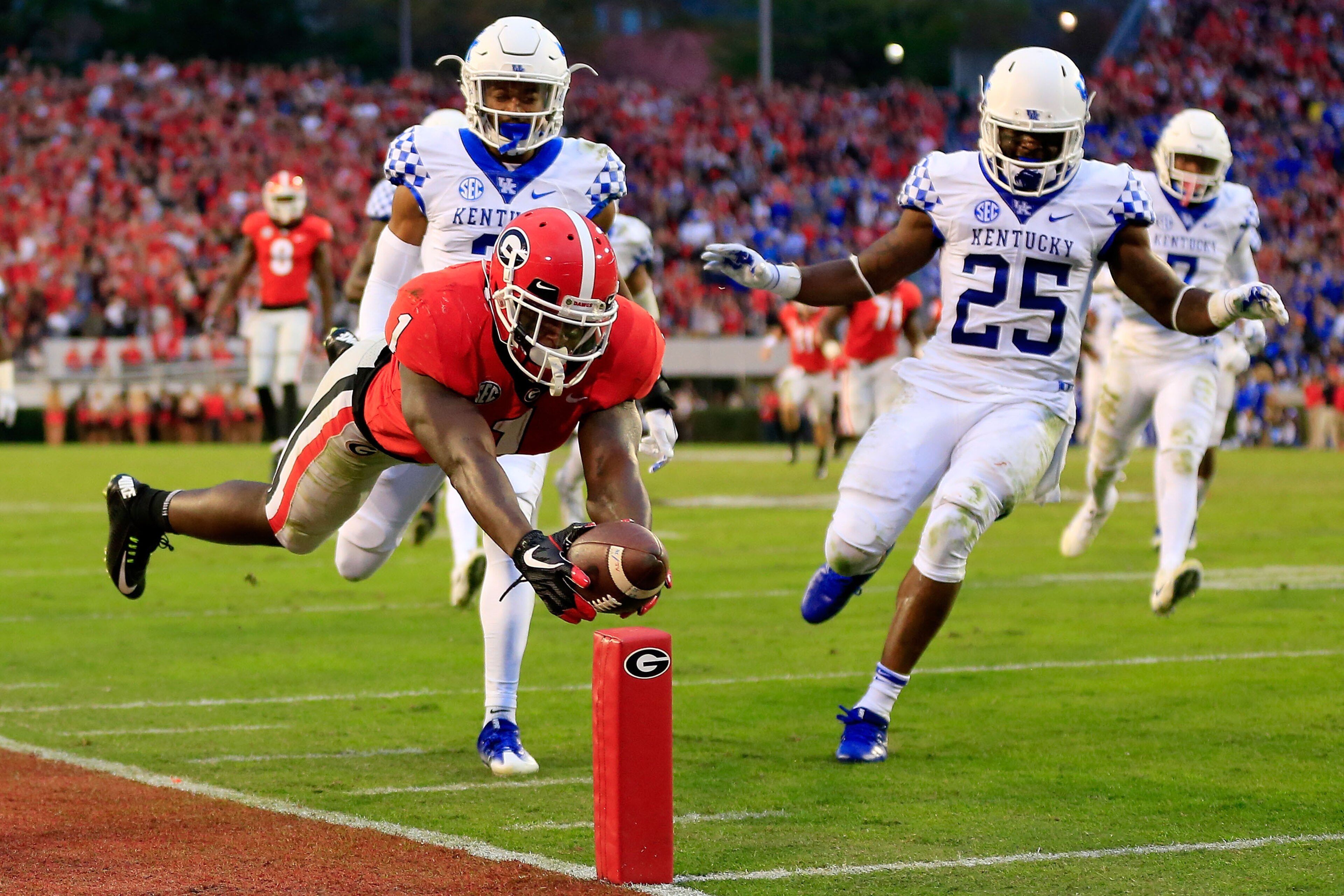 ATHENS, GA - NOVEMBER 18: Sony Michel #1 of the Georgia Bulldogs dives into the end zone for a touchdown during the first half against the Kentucky Wildcats at Sanford Stadium on November 18, 2017 in Athens, Georgia. (Photo by Daniel Shirey/Getty Images)