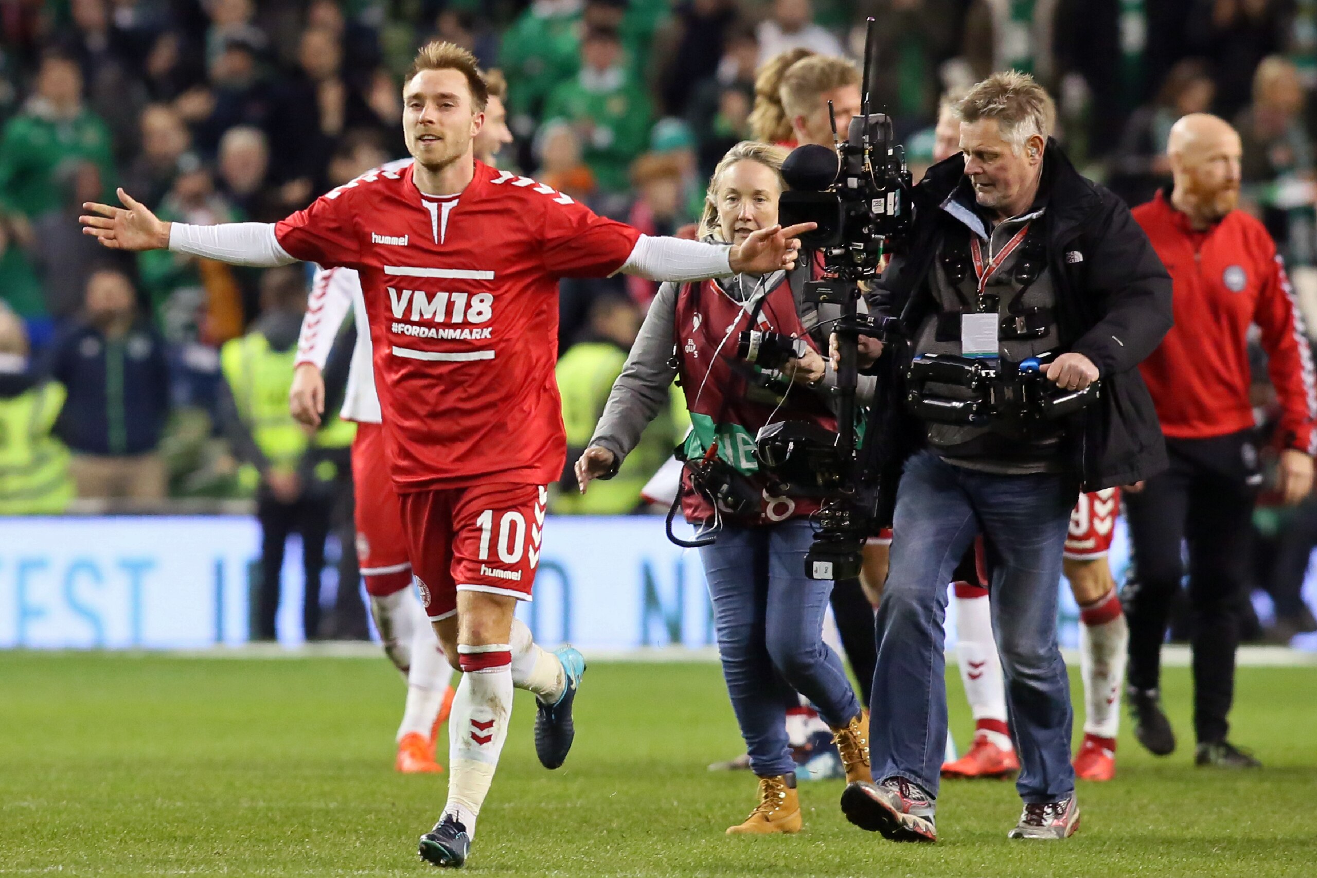 Denmark's midfielder Christian Eriksen (L) celebrates on the pitch after the FIFA World Cup 2018 qualifying football match, second leg, between Republic of Ireland and Denmark at Aviva Stadium in Dublin on November 14, 2017.
Christian Eriksen scored a mag