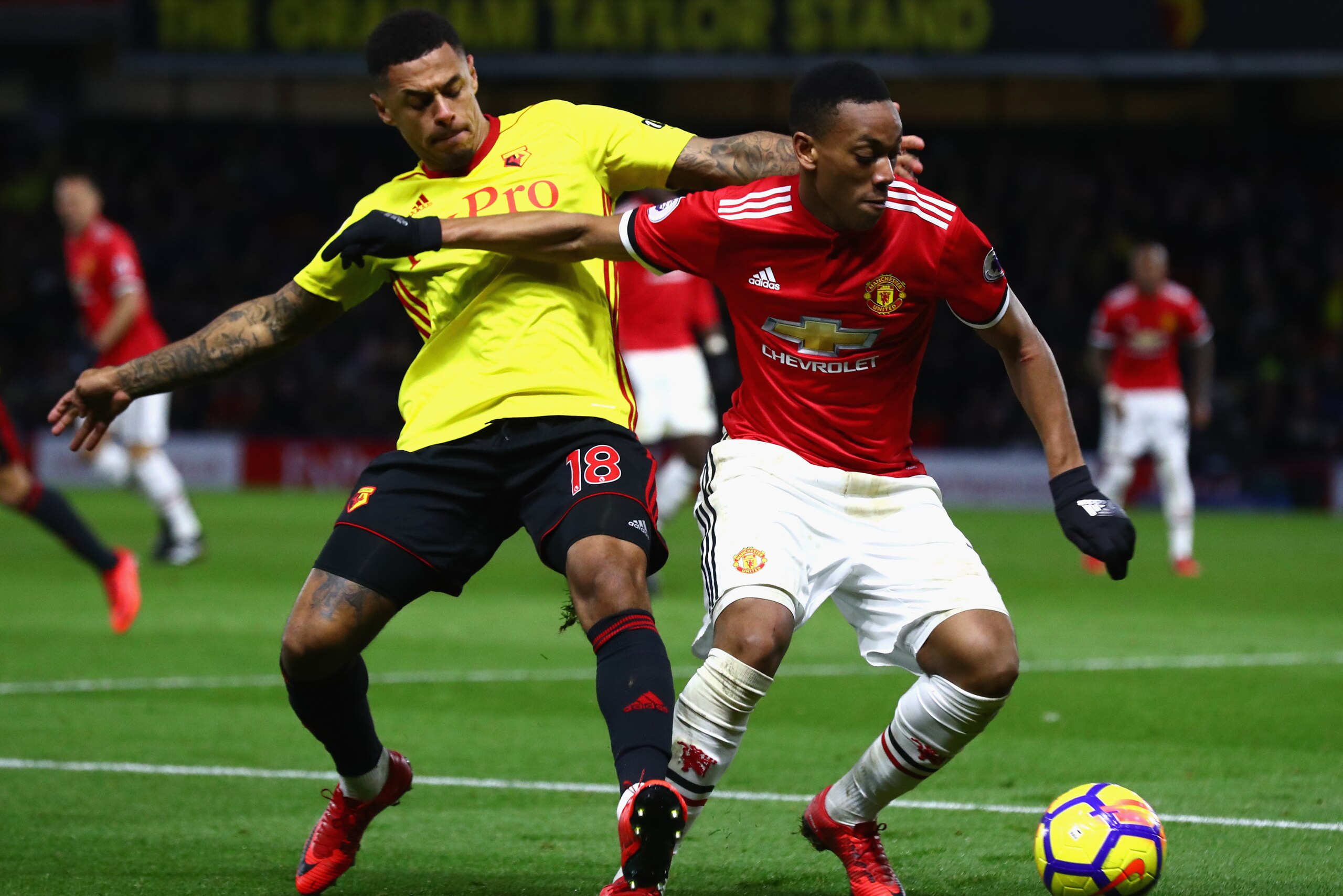 WATFORD, ENGLAND - NOVEMBER 28: Anthony Martial of Manchester United and Andre Gray of Watford in action during the Premier League match between Watford and Manchester United at Vicarage Road on November 28, 2017 in Watford, England.  (Photo by Clive Rose