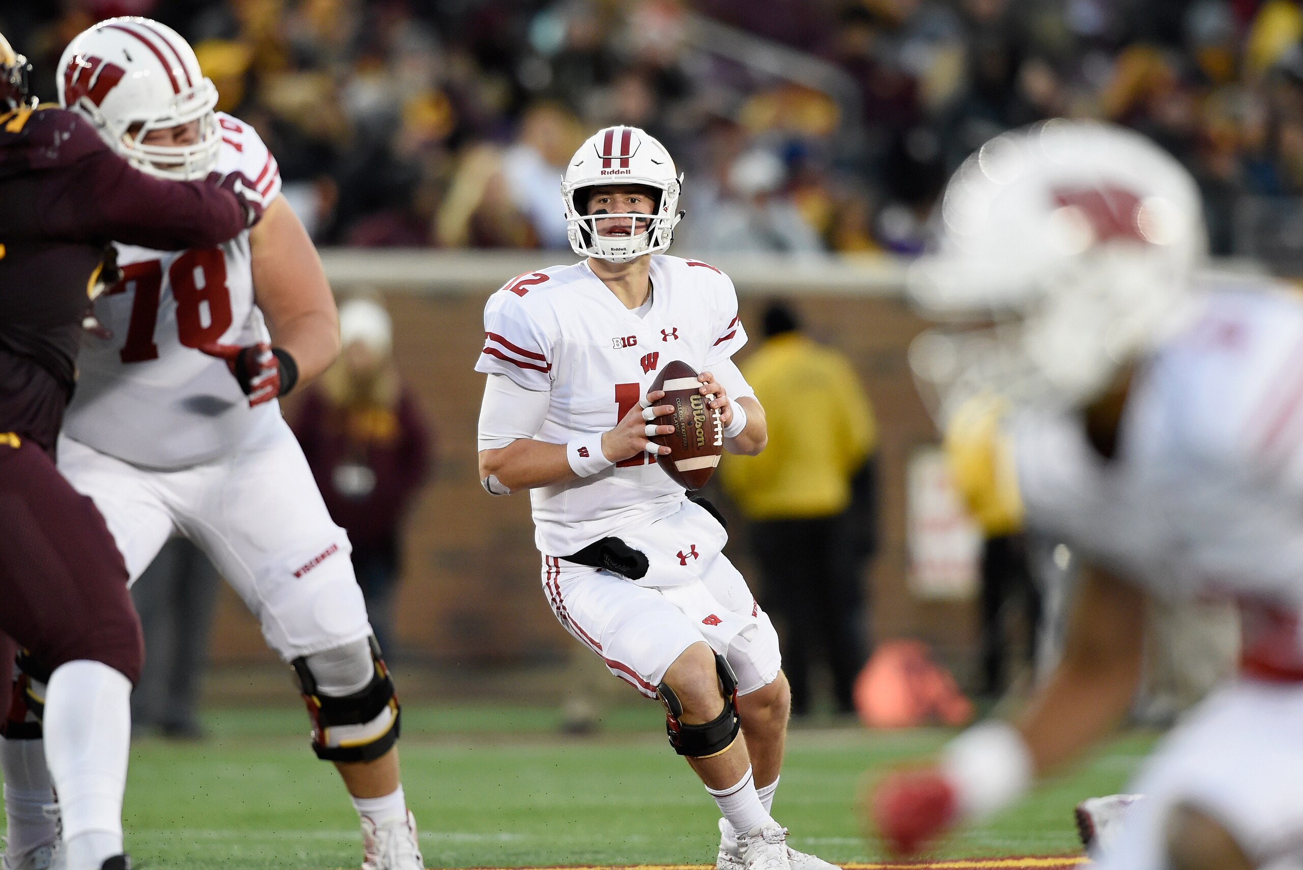 MINNEAPOLIS, MN - NOVEMBER 25: Alex Hornibrook #12 of the Wisconsin Badgers looks to passes the ball against the Minnesota Golden Gophers during the third quarter of the game on November 25, 2017 at TCF Bank Stadium in Minneapolis, Minnesota. The Badgers 