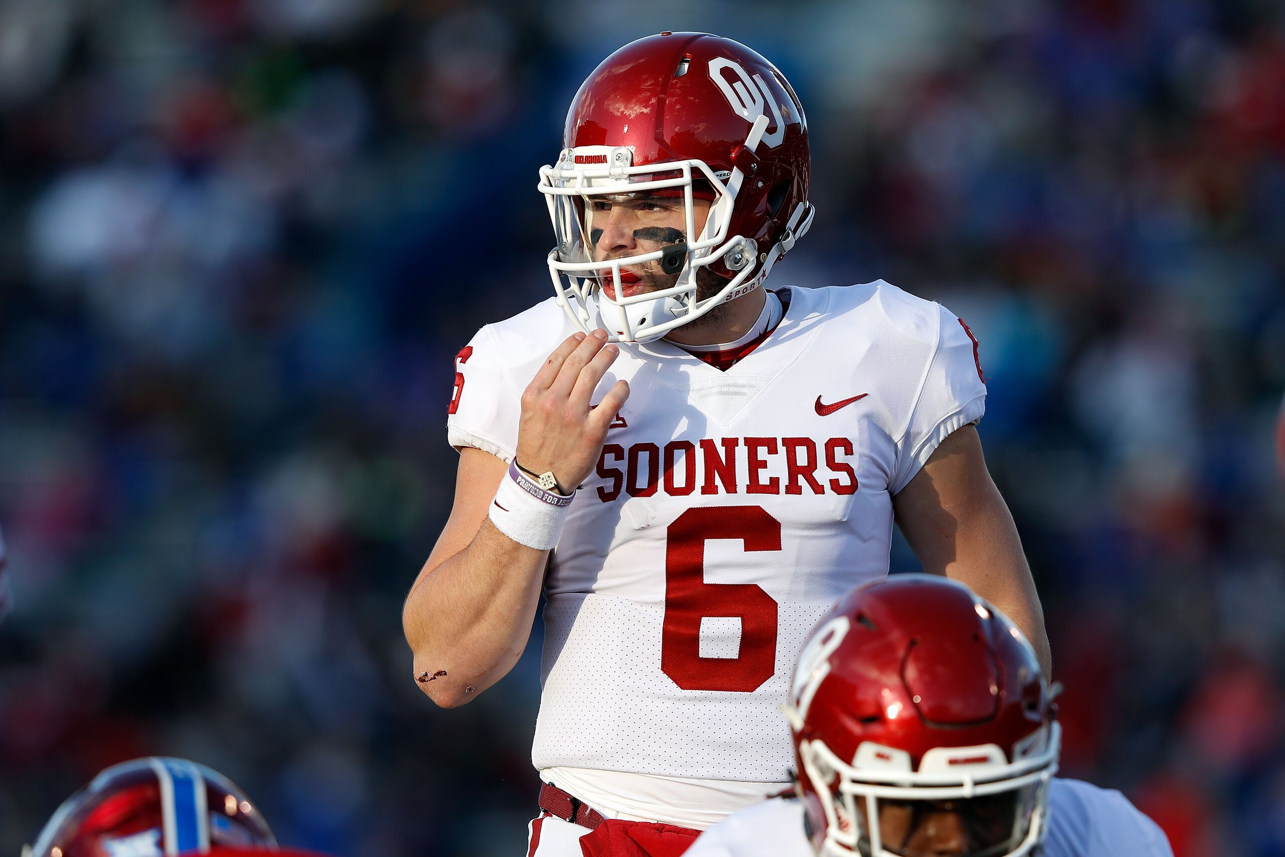 LAWRENCE, KS - NOVEMBER 18: Quarterback Baker Mayfield #6 of the Oklahoma Sooners prepares to take a snap during the game against the Kansas Jayhawks at Memorial Stadium on November 18, 2017 in Lawrence, Kansas. (Photo by Jamie Squire/Getty Images) LAWRENCE, KS - NOVEMBER 18: Quarterback Baker Mayfield #6 of the Oklahoma Sooners prepares to take a snap during the game against the Kansas Jayhawks at Memorial Stadium on November 18, 2017 in Lawrence, Kansas. (Photo by Jamie Squire/Getty Images)