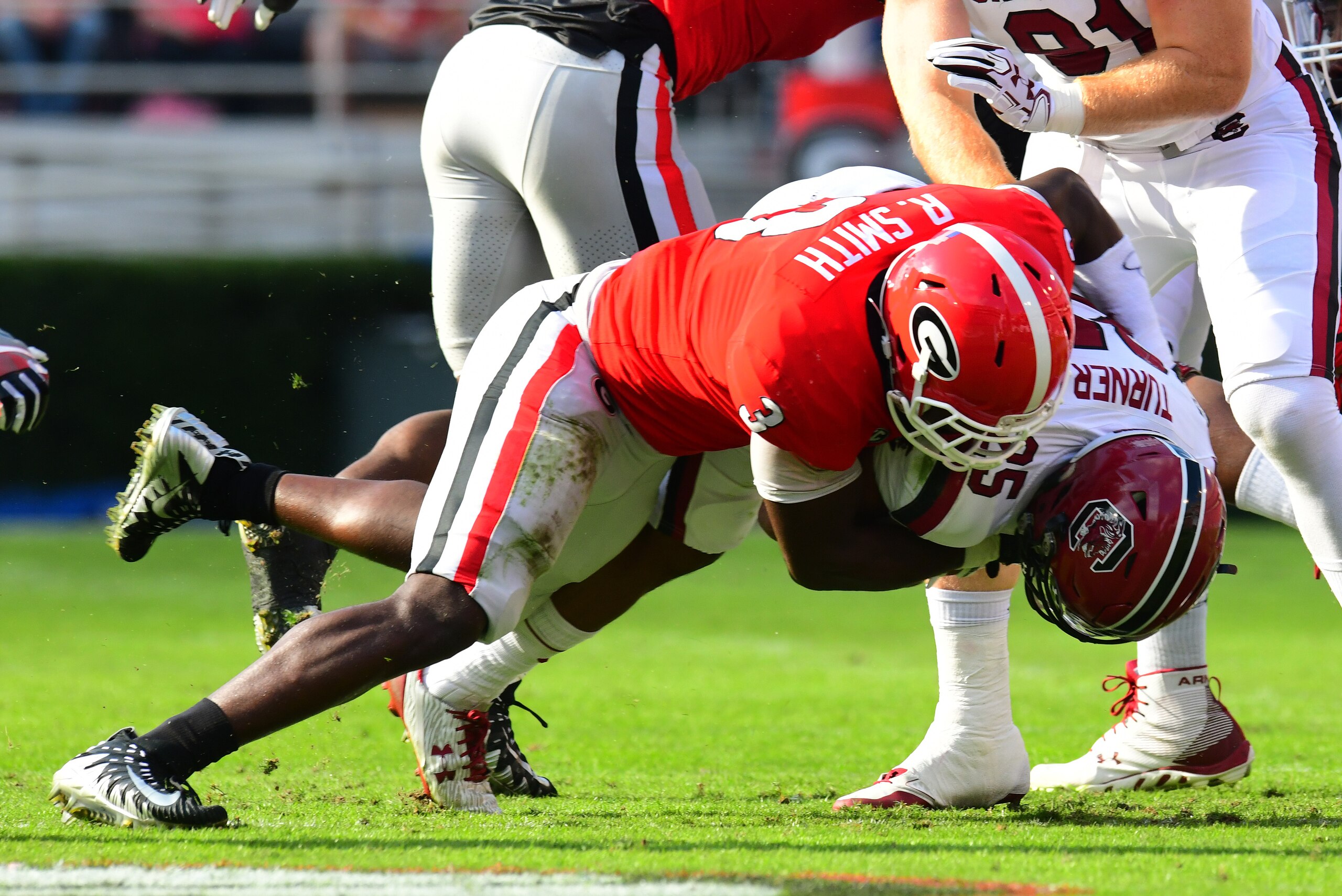 ATHENS, GA - NOVEMBER 4: A. J. Turner #25 of the South Carolina Gamecocks is tackled by Roquan Smith #3 of the Georgia Bulldogs at Sanford Stadium on November 4, 2017 in Athens, Georgia. (Photo by Scott Cunningham/Getty Images)