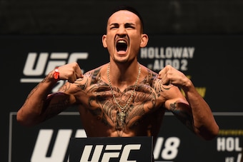 DETROIT, MI - DECEMBER 01:  Max Holloway poses on the scale during the UFC 218 weigh-in inside Little Caesars Arena on December 1, 2017 in Detroit, Michigan. (Photo by Josh Hedges/Zuffa LLC/Zuffa LLC via Getty Images)